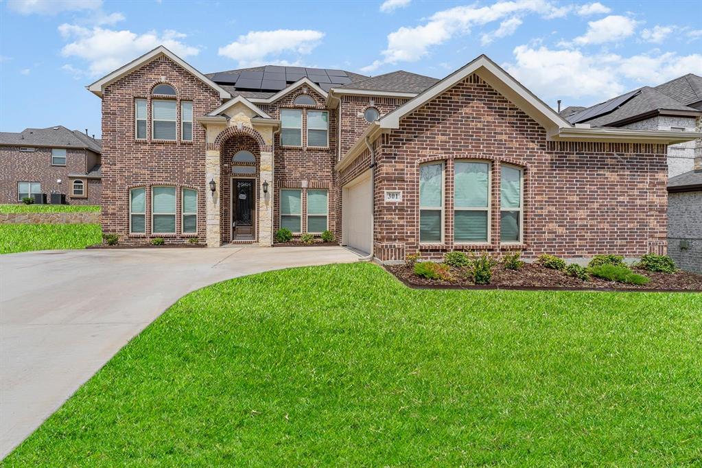 Beautiful 6 bedroom, 4 bathroom two-story home with office, game room, media room + BONUS side yard on oversized lot in The Villages at Charleston! This Crestwood floor plan offers it all! Open concept living and dining with breathtaking spiral staircase and floor to ceiling stone finished gas fireplace. Modern gourmet kitchen features granite countertops, breakfast bar island, gas cooktop, pot filler, double oven, coffee bar & more! Extra spacious primary bedroom downstairs with backyard access, en suite dual sinks, walk-in shower, garden tub + XL walk-in closet! Downstairs guest bedroom with en suite bath. Secondary bedrooms + media room upstairs. Home is complete with private backyard, covered patio, Larson security doors & cameras and solar panels.