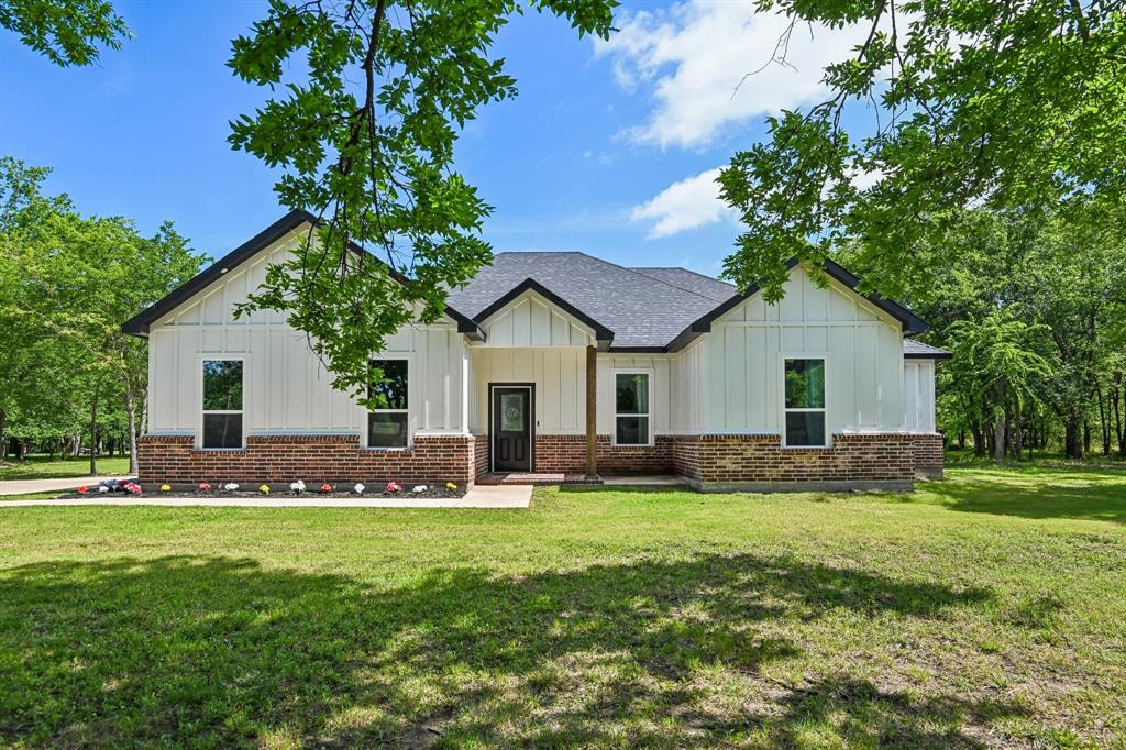 Wide open space, no HOA, and room to truly spread out, welcome home! Sitting on just over 2 acres, this beautifully designed 4-bedroom, 3-bath home delivers the space and layout everyone is looking for. The open main living area centers around a cozy corner fireplace, and the kitchen is a dream with a center island, breakfast bar, spacious pantry, and open dining. The primary suite is a true retreat featuring a soaking tub, separate shower, dual vanity, and a spacious closet. The laundry room is generously sized with a sink and cabinets, because the details matter. A side entry garage rounds it out nicely inside. Outside is where this home truly shines. The covered rear porch is built for entertaining, complete with a built-in grill and sink. Add a spacious backyard on over 2 acres and you have the perfect setup for gatherings, relaxing, and enjoying Texas evenings. Located just east of Dallas between I-20 and I-30, you get the peace of country living without sacrificing convenience. Lake Tawakoni, known as the Catfish Capital of Texas, is just 7 miles away, offering boating, fishing, and outdoor fun year-round. Dallas is only about 45 minutes away, and Rockwall and Greenville are easy day trips for shopping, dining, and entertainment. Zoned to Boles ISD.Come tour it, acreage like this at this price point won't last! Discounted rate options and no lender fee future refinancing may be available for qualified buyers of this home.