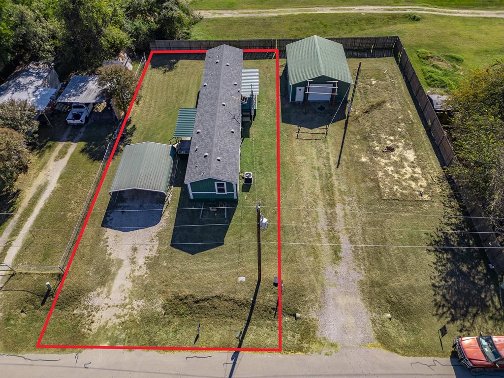 Affordable lake living meets everyday comfort in Pelican Bay — a welcoming lakeside community just moments from Eagle Mountain Lake. This well-maintained 3-bedroom, 2-bath manufactured home offers approximately 1,216 sqft of functional space on a .177-acre lot with no HOA & direct community access to a private boat ramp & fishing pier. Inside, a split-bedroom floorplan delivers comfort & privacy throughout. The open-concept layout connects the living, dining, & kitchen areas for easy everyday flow & effortless entertaining. The kitchen features black appliances, ample counter space, a high-top breakfast bar, & a hidden cabinet that opens to a cleverly combined pantry & laundry room — a smart use of space that keeps the home organized & functional. The primary suite is privately positioned & includes a large walk-in closet, dual sinks, a garden soaking tub, & a separate shower. Two secondary bedrooms & a full guest bath are located on the opposite side of the home, offering flexibility for family, guests, or a dedicated workspace. Outdoor living is easy with covered porches at both the front & rear entrances, a 2-car carport, & a flat, usable yard with room for pets, gardening, or recreation. Pelican Bay residents enjoy the lake lifestyle while staying close to local conveniences in nearby Azle — grocery stores, shopping, & dining all within easy reach. Whether you're searching for a primary residence, weekend retreat, or investment opportunity, this home delivers value, location, & flexibility with no HOA restrictions.