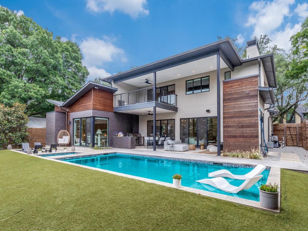 Exceptional Lakewood Living.  Just Steps from White Rock Lake!

Discover this one-of-a-kind custom home nestled on an oversized lot in the heart of Lakewood, surrounded by estate homes and just a short stroll from walking and biking paths, White Rock Lake, and quiet Dominique Park. This thoughtfully designed residence is filled with beautiful natural light and offers the perfect blend of luxury, comfort, and functionality for adults and kids alike.

The open-concept floor plan features elegant finishes and a climate-controlled wine cellar, ideal for entertaining. The spacious downstairs primary suite provides a peaceful retreat, with a corner glass window looking onto your backyard oasis and entertainment area.  A second bedroom on the main floor is perfect for a nursery, guests or multi-generational living. Upstairs, you'll find three additional bedrooms, a generous game room area, and another versatile flex space ideal for a home office, gym, bedroom or creative studio.

Step outside to your private, turfed backyard with mature Magnolia trees for added privacy, a stunning pool and spa, outdoor kitchen, and sunken lounge area with fire pit. An outdoor bathroom adds convenience for poolside gatherings.  On the second floor, just off the second living room, you'll find an oversized covered patio, also overlooking the entire backyard entertaining area.

Architectural details shine throughout with a striking blend of hand-troweled stucco, iron spot brick, and rich Douglas fir accents delivering a warm, modern aesthetic inside and out.  So many extras to see!

This home offers a rare opportunity to live, work, and entertain in one of Dallas’ most sought-after neighborhoods, with nature right outside your door.

Measurements and room sizes are approximate.  Buyer and Buyer's Agent to verify all information provided in this listing.