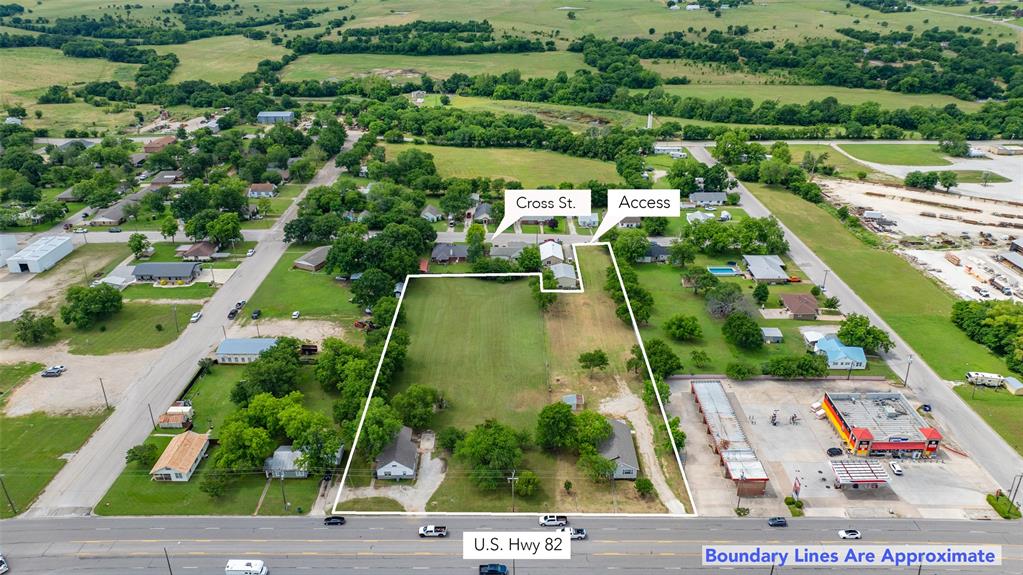 HUGE INVESTMENT POTENTIAL IN THE MIDDLE OF MUENSTER!  Currently packaged as one rare opportunity, here is your chance to gain 2.68 acres of HWY 82 frontage (aka Division St) and secure two tracts and two rent homes at the same time.  Currently zoned Single Family, the City of Muenster has expressed vividly that they will consider Mixed Use for these two tracts which opens the door for a variety of commercial use.  Multiple access points off Division St. and another access point off Cross St. on the southside.  The 1.08ac tract at 322 E Division (CAD 15570) features a newly remodeled in 2024, 3bed,2bath, 1432sf home. This house is currently rented for $2,000 a month and boasts 2024 HVAC, decorative lighting, stainless appliances, granite counters, vinyl plank flooring along with newer roof and updated windows.   This tract stretches from Hwy 82 in the front to Cross St in the back for extra ingress and egress.  The 1.6ac tract at 410 E Division (CAD 16046)  features a 1200sf 2bed, 2bath home with central heat and air, lg bedrooms and plenty of storage.  This house is now rented for $1,300 per mo for 12 months starting Sept 1, 2025.  City utilities, Encore electricity, and Atmos Gas service the heater and the cooktops in both homes.  The end use for this property is wide open, the City of Muenster encourages conversation about bringing your business to town and this land is the perfect blank canvas to do it.