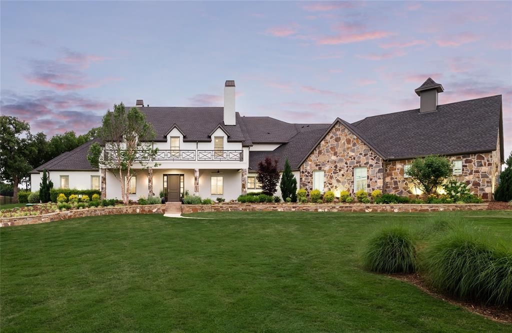 Stunning newer construction in coveted Tour 18 golf community on 2.230 sprawling acres with high-end features and light + bright open concept design. Enjoy indoor, outdoor living year round in approx 8,336 sq ft + additional 379 ft unfinished flex space, 4FPs, 4 laundry rms, attached 2 room fully equipped apartment, large ensuite bedrooms, downstairs game and media + fitness or flex room, fabulous main utility and mud room, 18 Seer HVACs, tankless WHs, elevator ready, remote patio screens, Sonos, outdoor covered kitchen + grill veranda, resort style pool with water features and LED lights, plus 1,489 sq foot 5 car garage w workshop and sink. This home has it all in the 24 hr guard gated community, within the exemplary Argyle ISD.
SELLER HAS RECEIVED MULTIPLE OFFERS. BEST AND FINAL MUST BE DELIVERED TO AGENT BY 12 NOON, MONDAY MAY 15, 2023.