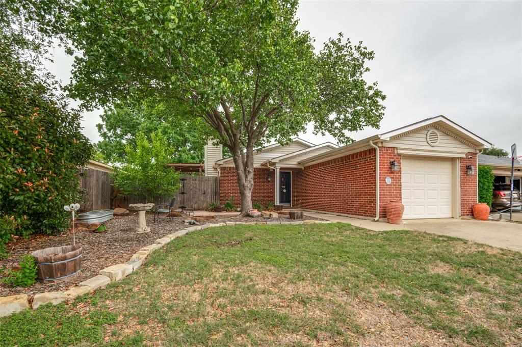 Adorable! This cute home has been well maintained and ready for new owners. Located in the Marine Creek Hills neighborhood. Two nice sized bedrooms. Primary has large bathroom and walk in closet. Nice living area with natural light and cozy wood burning fireplace. Enjoy the backyard with great sitting area for fun cook outs and entertaining. New windows were installed in 2025. Water softener system.  Close to shopping and restaurants.