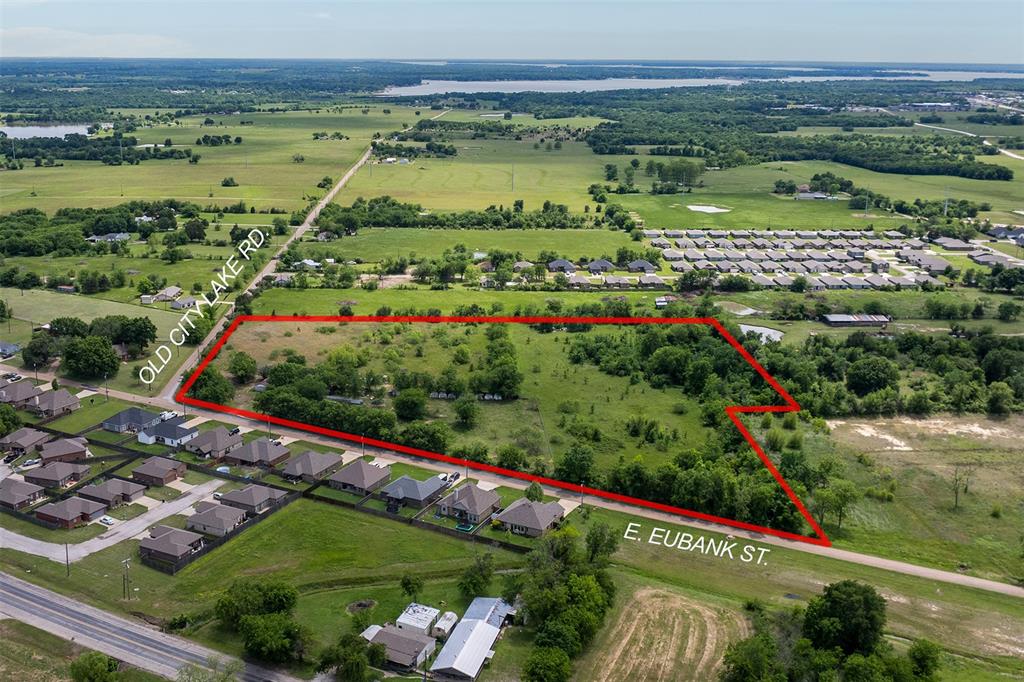 Prime 10+ acre tract located within city limits, offering a rare opportunity for development, investment, or a private estate. This expansive property features open, level to gently rolling terrain, ideal for residential development, subdividing, or continued agricultural use (subject to city zoning). With city utilities nearby and road access, the possibilities are wide-ranging for builders, investors, or those seeking acreage with in-town convenience. Enjoy the balance of space and accessibility, just minutes from local amenities, shopping, and schools. A unique chance to secure sizeable acreage in a growing area with strong future potential.
