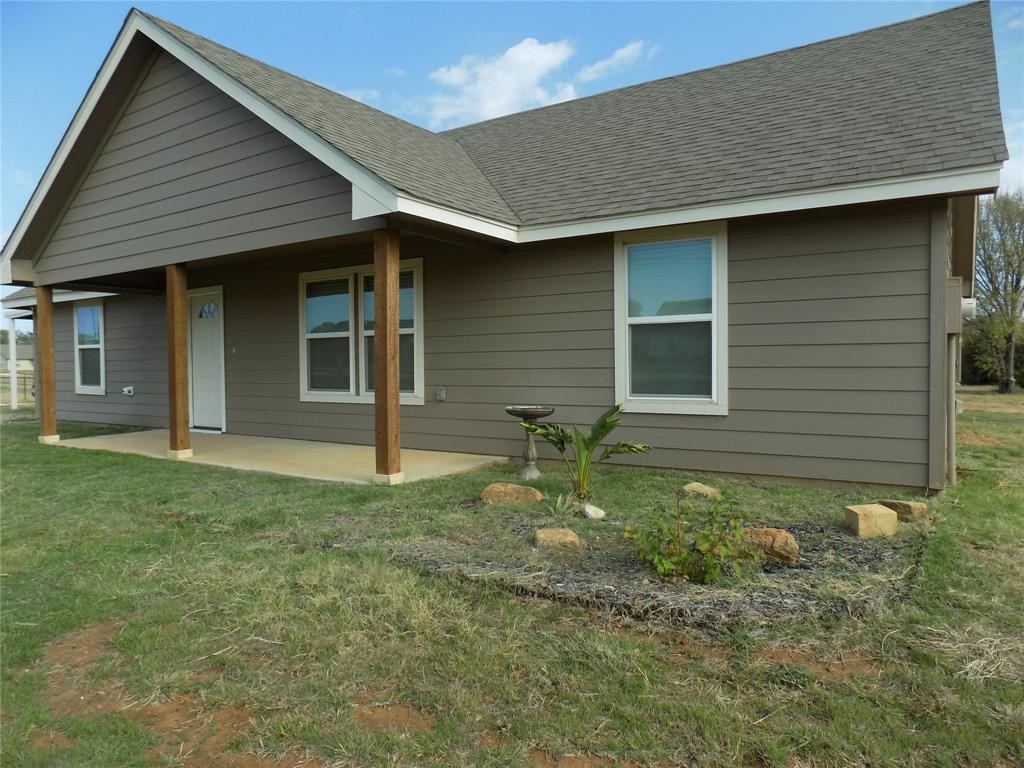 THIS HOME MEETS A MULTITUDE OF FINANCING POSSIBILITIES:  FHA, VA, USDA CONVENTIONAL, AND CASH.  Escape to this stunning home, tucked away in the country, but close to the cities of Springtown and Weatherford. Beautifully designed with open floor plan features that offer a light and bright environment with granite countertops throughout the home, ceiling fans in every room, lovely bathrooms and a kitchen that is a dream come true. This home has the new home feeling with split bedrooms, large closets, a large living area, perfect for family gatherings and entertaining guests. The backyard can accommodate outdoor activities and has space enough for additional buildings.  Bring your chickens, as well, as there is an on-sight chicken coop available for your use. Unique, custom features throughout the home. Come on out and visit the home, and the welcoming community.