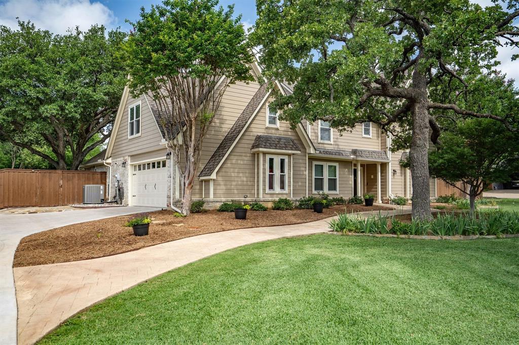 Tucked into the heart of Double Oak, one of North Texas's most loved small-town communities, 410 Simmons Road offers an extraordinary opportunity to own a beautifully maintained home on just over an acre, minutes from Flower Mound, Highland Village, and DFW Airport. From the moment you open the double front doors, you're drawn into an expansive living room anchored by a fireplace and flanked by custom built-in cabinetry framing a large picture window overlooking a spectacular tree-lined lot. The formal dining room easily accommodates a table for ten and flows into the kitchen, featuring updated cabinetry, abundant storage, and a sunny breakfast nook bathed in natural light from skylights above.
The primary suite is a private sanctuary with a cozy fireplace that feels like a boutique hotel that never requires checkout. The fully remodeled en-suite showcases a grand walk-in shower with finishes that feel indulgent rather than incidental. Upstairs, three generously sized bedrooms, a full bath, reading nook, office space, and a large game room round out a second floor designed for how families actually live.
The backyard is built for Texas summers, featuring a sparkling saltwater pool, covered patio, and plenty of room to grill & unwind. The guest house is a genuine bonus, equipped with electrical and an air-conditioning unit for year-round comfort and ready to become whatever you need: home office, gym, game room, or creative studio. An RV concrete pad with a 30-amp hookup adds rare practicality, while stone walkways, an epoxied garage floor, and TrimLight exterior lighting give the property a polished, well-considered finish.
Major upgrades include a 2023 roof, Lennox variable-speed HVAC system, Simonton energy-efficient windows, a resurfaced and retiled saltwater pool, and a walk-in attic with a reinforced floor replaced in 2019, providing exceptional storage space for all your household essentials. All of this is offered with no HOA.
