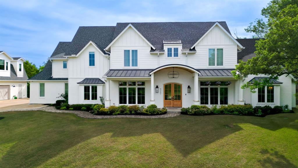 NEW LISTING! A Private Gated Drive Leads to This Stunning Hilltop Resort-Style Estate on 3 Acres. Thoughtfully crafted with superior construction and design, the home features a state-of-the-art foundation, full spray foam insulation, and advanced smart home integration throughout. Inside, you’ll find expansive living spaces complemented by high-end finishes, including GE Café appliances, a built-in plumbed coffee system, nugget ice maker, dual laundry rooms, and a private guest ensuite. The primary suite offers a true spa experience with a steam shower, integrated audio, and seamless smart controls.

Technology and convenience are at the forefront, with app-controlled systems for lighting, security, climate (including LG mini-split HVAC), shades, media, and even the irrigation system that maintains the lush Zoysia lawn.

Beyond the main residence, the property continues to impress with an oversized three-car garage and a detached 1,200-square-foot shop complete with an upstairs retreat, ideal for a man cave, studio, or flex space.

The outdoor experience rivals a private resort. Enjoy a fully lit 30x30 basketball court, putting green, and an incredible pool oasis featuring a water element, spa, cedar cabana, and swim-up bar. Entertain effortlessly with a fully equipped outdoor kitchen, granite countertops, grill station, mini refrigerator, TV connections, integrated speakers, fireplace, and a motorized screened-in patio for year-round enjoyment.

A firepit and serene, heavily wooded acreage with a private creek and walking trail complete the setting offering both recreation and tranquility in one remarkable property.