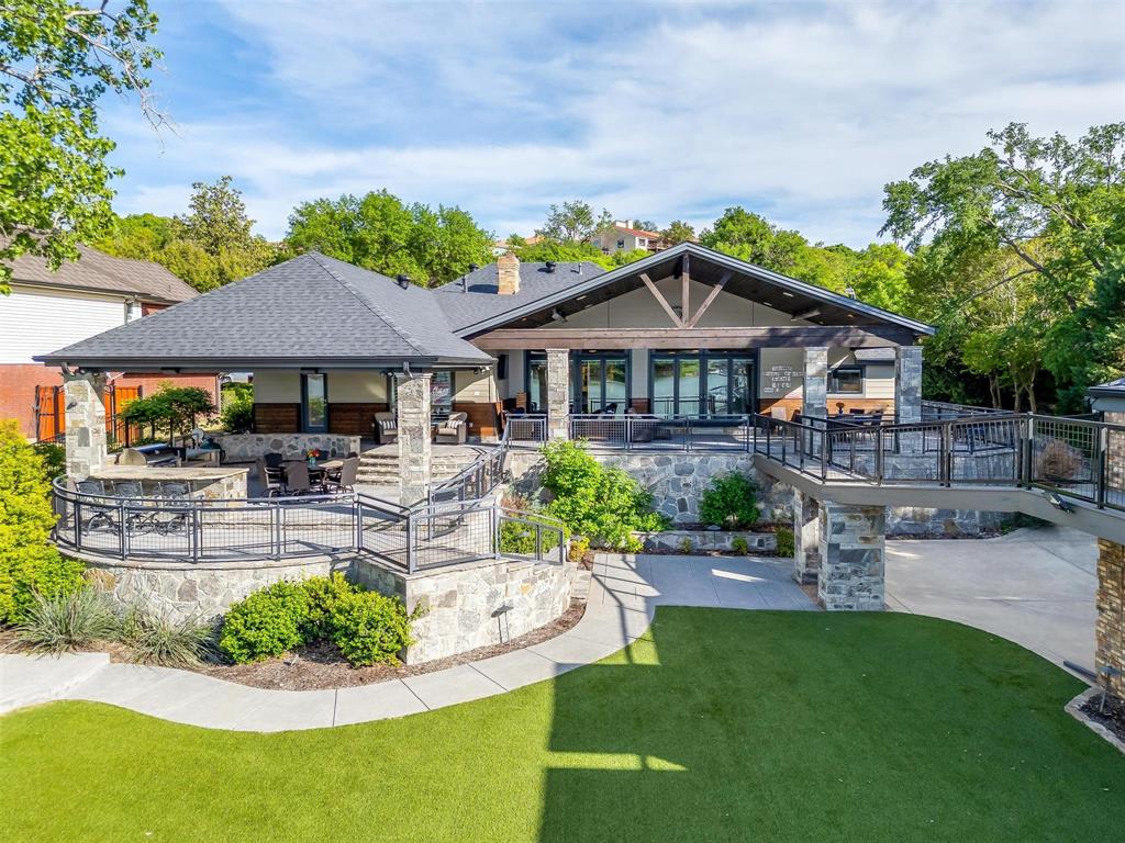 Situated on the SHORES OF EAGLE MOUNTAIN LAKE in Dosier Slough – This stunning, fully gutted and renovated luxury home is the ultimate in entertainment with expanded outdoor living space, boat dock with jet ski lifts, enclosed boathouse, detached guesthouse with deck and artificial turf for low maintenance!  No expense was spared when this home was rebuilt.  Well executed and designed floor plan of main home offers 4 bdrms with 3 fulls baths, walls of windows overlooking the lake and full audio system in all rooms and outdoor areas.  Lighted concrete retaining wall tiered to the lake with sitting area. 4 car garage.  This home comes fully furnished so grab your suits and start the lake season off right!