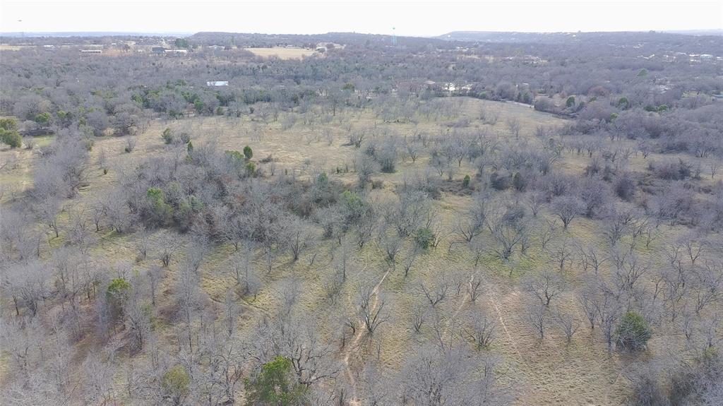 20-acre tract located just outside city limits, with road frontage on two sides. This beautiful property features abundant possibilities, offering privacy and natural beauty throughout. Co-op water and electricity are available, making development or recreational use even more convenient. With no city restrictions, the land offers endless opportunities for residential, agricultural, recreational, or investment use.