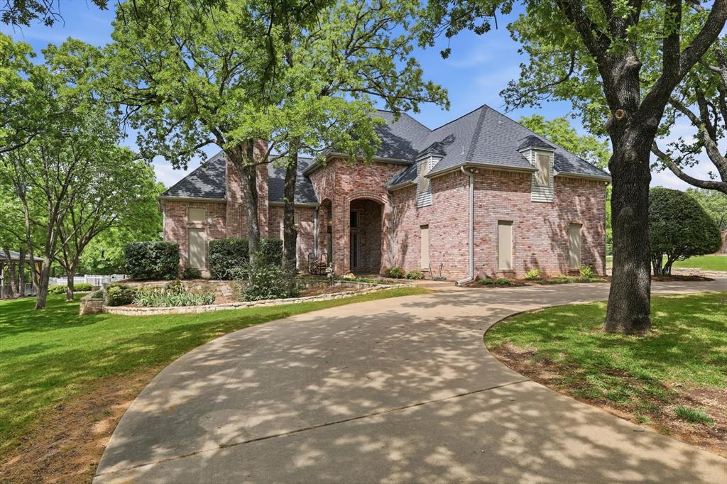 Welcome to 1496 Rolling Acres Drive where modern updates meet timeless Texas living. Situated on a full acre in the quiet, sought-after community of Rolling Acres, this beautifully renovated home offers space, privacy and style, all within the award winning Argyle ISD! The completely reimagined interior features 4 bedrooms, 3 full bathrooms, a powder bathroom for guests and a versatile game room-flex space designed to adapt to your lifestyle. Enjoy two spacious living areas- one anchored by a cozy fireplace with custom built-ins and the other highlighted by sliding glass doors that open seamlessly to the patio, creating an ideal flow for indoor-outdoor living and entertaining. Step outside to your own private retreat, an expansive one-acre lot complete with a sparkling pool and spa, large gazebo and plenty of room to relax or host guests. A circle driveway adds both convenience and curb appeal, while a large detached workshop offers the perfect space for hobbies, storage, or projects. With no HOA and low taxes, this property offers the perfect combination of flexibility and value in one of Arygle's most desirable locations! A rare opportunity to own a fully updated property with land, a pool, and access to one of the most sought-after school districts in North Texas.