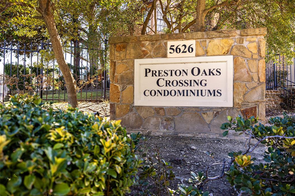 Located in a gated townhome community near the heart of Addison, this beautifully maintained condo-style townhouse offers an exceptional combination of location, value, and low-maintenance living—perfect for an owner-occupant or investor. The home features two spacious bedrooms, each with a private ensuite bath, plus a convenient half bath for guests. A standout feature is the enclosed one-car garage that accommodates a 20' long truck, providing secure, protected parking along with a storage closet and shelving—an increasingly rare and valuable amenity in this area. Inside, enjoy a warm and inviting living space with a wood-burning fireplace, enhanced by fresh interior paint, updated lighting, luxury vinyl plank flooring, and newer carpet. A dedicated utility room adds everyday functionality, while the 8’ x 10’ covered balcony with TV offers an ideal space for relaxing or entertaining. All appliances convey, including the refrigerator, washer, and dryer, making this home truly move-in ready. The gated community offers ample additional parking for owners and guests, along with resort-style amenities, including two pools and a clubhouse. The prime location places you just minutes from Addison’s popular dining, shopping, and entertainment, with quick access to the Dallas North Tollway and Galleria Mall—a major advantage for commuters and renters alike. Whether you’re ready to stop renting and start building equity, seeking a lock-and-leave lifestyle, or looking for a strong investment in a high-demand location, this property delivers. Garage parking, gated living, amenities, and outstanding value—this one truly has it all.