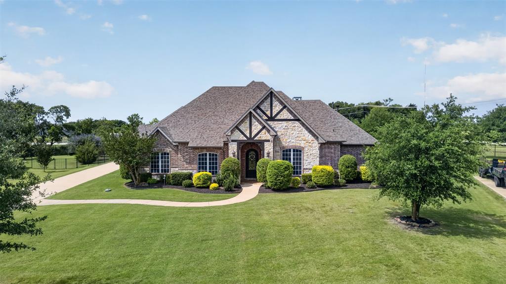 Nestled within the gated community Waterstone Estates of McKinney, TX, this immaculate Global Luxury property is an oasis of sophistication and comfort. Boasting 4 spacious bedrooms, 3 full bathrooms, one half bath, and a 3-car garage, this home offers unparalleled amenities and a seamless blend of luxury and functionality.  Step into the foyer and be welcomed by an open floor plan bathed in natural light, featuring soaring ceilings and impeccable finishes. The gourmet kitchen is a chef's dream, equipped with stainless steel appliances, granite countertops, and a generous center island perfect for entertaining. Adjoining the kitchen is a warm and inviting living area, adorned with a custom fireplace and expansive windows that offer picturesque views of the manicured backyard. The second living area is situated just off of the kitchen and encompasses a half bath with an exterior door.  Access the screened in back patio from both living areas and  primary suite, allowing a seamless flow for indoor and outdoor entertaining.  The screened in patio features a fireplace and ceiling fans, perfect for outdoor dining.  The primary suite is a sanctuary of relaxation, complete with a luxurious ensuite bathroom featuring a soaking tub, walk-in shower, dual vanities, and an oversized walk-in closet. Each additional bedroom is generously sized, offering its own private bathroom and ample closet space. The floorplan offers a 3 way split for the bedrooms which offers privacy within the home.  The well-maintained exterior is just as impressive, with manicured landscape, a heated pool with hot tub, poolside pergola, and plenty of green space. Whether you’re enjoying a morning coffee on the patio or hosting a summer BBQ, the outdoor spaces are designed for enjoyment and tranquility.  Experience the epitome of luxury living in McKinney with this meticulously crafted home that promises comfort, style, and elegance. Check out nearby Melissa ISD's new policy on out of district transfers