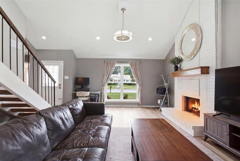 Welcome to this meticulously maintained home on a large corner lot, ideally located near schools and shopping with easy access to major highways. The President George Bush Turnpike (190) is just one mile away — reachable via Marsh Ln., Frankford, Rosemead, or Kelly — and Highway 121 is close by, making commutes and weekend getaways a breeze. Inside, vaulted ceilings create an open, airy feel, while the kitchen shines with granite countertops, a center island, and a sunny bay window breakfast nook. A smart split-bedroom layout offers privacy, and the upstairs den makes a perfect home office or play space. Out back, enjoy a covered patio plus a finished bonus building — a versatile flex space ready for a home gym, studio, hobby room, or quiet retreat. The property is fully fenced with an electric gate leading to an upgraded covered driveway, complete with a Tesla charging station. Thoughtfully updated and move-in ready, this one truly has it all.