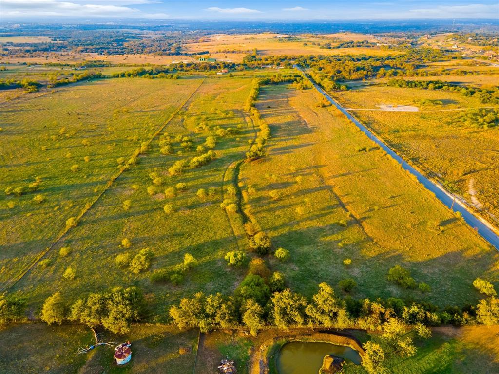 Approximately 10 miles west of Fort Worth on I-20 and approximately 4.5 miles south of I-20 on FM 5, 132 usable acres, prime for residential development in the highly sought-after Aledo school district. Gently sloping topography yields big panoramic views from Benbrook to Hudson Oaks!  Adjacent to the popular Bear Creek drainage. 2045 feet frontage on Muir Road and 2765 feet frontage on Savage Lane. In close proximity to the newly proposed 2,400 acre Kelly Ranch residential and golf community. Easy commute to Fort Worth, Weatherford and Granbury. Livestock on property. Shown by appointment only.  Serious inquiries only!