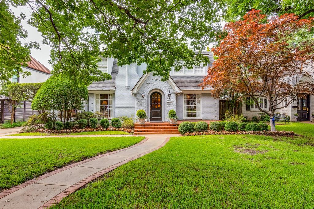 Just two blocks from Bradfield Elementary and Highland Park Village this lovely 1939 Tudor home is on one of the most sought after University Park beautifully tree lined blocks. It is also within walking distance to the Park Cities YMCA and many other neighborhood favorite spots. The first floor has formal living and dining rooms, sunroom, family room, playroom(or 5th bedroom) with a full bath, as well as a spacious kitchen with breakfast area.  The first floor bedroom suite has large walk-in closets, a sitting area and a large bath with shower and tub.  Upstairs are three additional bedrooms with 2 full bathrooms. The private backyard is a nice size with an oversized 2 car garage full of storage with 629 sq ft quarters above.  This charming Tudor is being offered AS-IS. Bring your buyer with remodeling ideas or the 65ft by 155ft lot could be an excellent building site.