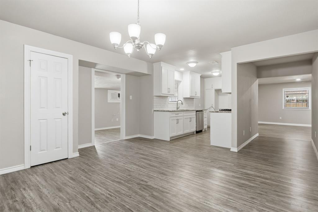 Welcome home to this beautifully remodeled 4 bedroom, 2 bath residence located in the highly sought after Burleson ISD! Thoughtfully updated to include a garage conversion, this home offers additional living space and a flexible floorplan designed for today's lifestyle.  Step inside to find abundant natural light, wood laminate flooring throughout the main living areas, and a warm, inviting layout. Just off the entry, you'll find two secondary bedrooms and a full guest bathroom to the left, with an additional bedroom located to the right. Continue into the heart of the home where the dining area flows seamlessly into the galley style kitchen and spacious living room.  The kitchen is both stylish and functional, featuring white shaker style cabinetry, granite countertops, stainless steel appliances, and plenty of workspace while remaining open to the dining area, perfect for everyday living and entertaining.  The living room is anchored by a stunning floor to ceiling brick wood burning fireplace, creating a cozy focal point for family gatherings. Privately tucked away at the back of the home, the primary suite offers a peaceful retreat.  The back of the home also offers a bonus room ideal for a secondary living room, game room, workout room, or hobby space.  Step outside to your own backyard oasis featuring a sparkling in-ground gunite pool just in time for relaxing Texas summers! A gated rear carport provides covered parking, while additional parking is available in the front of the home.  Conveniently located near Chisenhall Fields, Bailey Lake Park, walking trails, and shopping, this move in ready home combines comfort, functionality, and an unbeatable location with numerous recent upgrades throughout. Don't miss your opportunity to make this Burleson gem your next home!