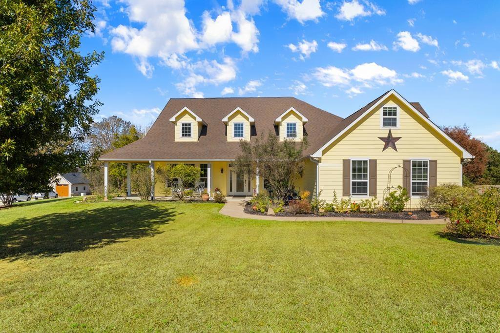 Are you in search of a truly exceptional property that can accommodate a large family while also offering abundant space and convenience? Look no further. This remarkable property features a spacious main home, a separate guest house, and a shop building, all situated within a secure and prestigious gated community. Set on an impressive 4.15-acre lot, this property offers breathtaking beauty both inside and out, with meticulously designed outdoor patios and inviting sitting areas perfect for relaxation. Additionally, it includes fantastic outdoor spaces for children to play and explore. The main home, custom-built in 2010, boasts 3 spacious bedrooms and 3 luxurious bathrooms. Notably, there are two master suites, one of which includes an ensuite bath with a large roll-in shower specifically designed for wheelchair accessibility, meeting ADA standards. Every entrance, both inside and out, is designed to accommodate wheelchairs, including the sidewalks that connect the various areas of the property. The craftsmanship throughout the home is truly outstanding, featuring high-quality finishes. The kitchen is a chef's dream, equipped with granite countertops, custom cabinetry, and a generously sized island for meal preparation and gatherings. The home offers a formal dining room, a spacious family room with a centerpiece fireplace, and an open-concept layout that makes entertaining effortless. There is also a separate formal living space, a large office for those who work from home, a spacious utility room, and a bonus room located on the upper level. High ceilings throughout the home create an open and airy feel, while the wood flooring and crown molding add an elegant touch. The screened-in back porch provides a serene place to unwind while enjoying the outdoors without being bothered by pests. The guest house, measuring approximately 1,218 square feet, is equally impressive. 1% off closing costs or rate buydown by using our Lender.