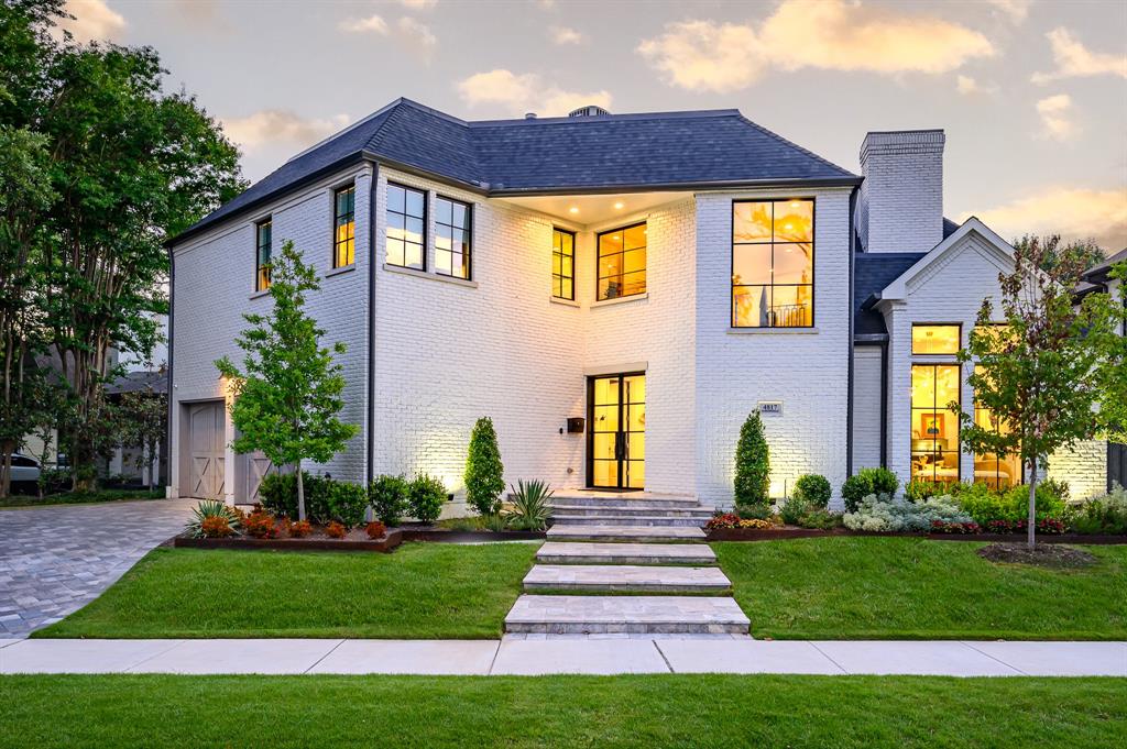 This beautifully reimagined Highland Park home, located in coveted Armstrong Elementary, was taken to the studs in 2017, with additional updates making it completely move-in ready. Ideally situated near Katy Trail, it offers an easy stroll to Knox Street’s vibrant shops & restaurants as well as stunning views of Abbott Park, pickleball & tennis courts. A commanding front exterior makes an unforgettable first impression, featuring a striking iron front door, Pella windows, & impeccable architectural details. Inside, the bright & sophisticated kitchen boasts a large marble island, Sub-Zero & Wolf appliances, & elegant Farrow & Ball painted accents. The kitchen seamlessly flows into the dining & family rooms, with an office & utility room conveniently located on the main level. One of the home's standout features is the open fireplace, creating a warm & inviting ambiance between the living area & front sitting room. Upstairs, the spacious primary suite includes a cozy sitting area, a luxurious bath with a freestanding tub, dual shower, & an oversized closet with a marble island. Three additional ensuite bedrooms with marble baths & a generous landing provide extra space for relaxation or entertaining. Designed for effortless outdoor living, the backyard is a true retreat. Heated pool with a sitting edge is surrounded by lush landscaping & a low-maintenance turfed lawn. A custom putting green, fully equipped outdoor kitchen, & inviting seating area make it perfect for year-round entertaining.  Additional features include wood & marble flooring throughout, soft-close cabinetry, Toto toilets, Brizo faucets, Emtek hardware, museum-finish walls, & LOOK Wallpaper. Major system upgrades include new plumbing, electrical, Trane HVAC, foam insulation, cedar garage doors,  new roof (2021). The home also boasts an encapsulated crawlspace & a Flo by Moen water shut-off system for added efficiency & peace of mind. A rare opportunity to own a thoughtfully designed, home in HPISD.