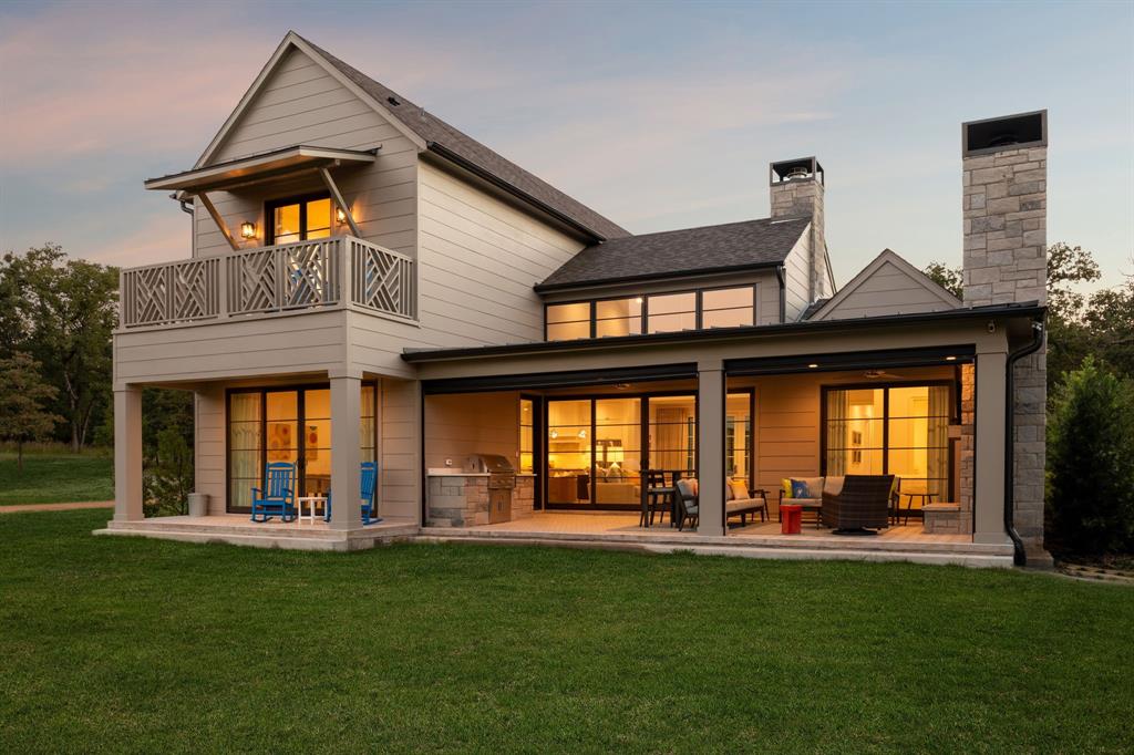 OFFERED FULLY FURNISHED

Thoughtfully designed for effortless lake living, this beautifully appointed residence offers a refined retreat within the coveted community of Long Cove. Tucked into the peaceful Eastport neighborhood, the home enjoys a serene setting beside a picturesque fishing pond, while an open-water boat dock and miles of scenic trails are just a short walk away—providing the perfect balance of privacy, tranquility, and easy access to the lake.

The home was designed with gathering in mind. Two primary suites on the main level provide comfort and convenience, while two spacious bunk rooms create an inviting space for hosting family and friends. Inside, designer finishes add warmth and sophistication throughout, creating interiors that feel both elevated and welcoming.

At the heart of the home, light-filled living spaces flow seamlessly to an oversized covered porch overlooking the pond—an idyllic backdrop for morning coffee, sunset dinners, and relaxed weekends at the lake. A built-in grill and retractable screens extend the outdoor living space, allowing for effortless entertaining and year-round enjoyment.

Offered fully furnished (with artwork excluded), the residence is truly turnkey—simply arrive and begin enjoying the Long Cove lifestyle. Located just steps from the upcoming Meadow Club, owners enjoy convenient access to the community’s celebrated amenities, including miles of scenic trails, golf, pickleball and tennis courts, resort-style pools, waterfront dining, and endless opportunities for recreation and connection.

Peaceful, beautifully designed, and ideally positioned, this home captures the essence of elevated lake living—where every detail is designed for comfort, gathering, and effortless enjoyment.