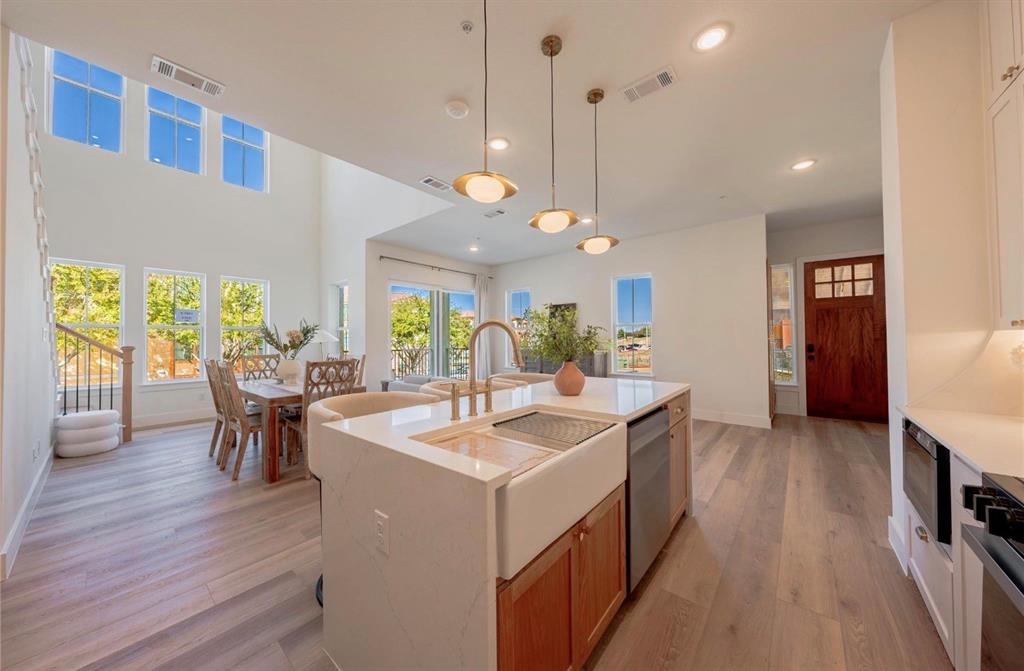 4.99% BUILDER INCENTIVE! Luxury Lifestyle delivered-Watersedge at Lake Ray Hubbard. Relax in this private & secure  Gated Waterfront Community  strategically positioned next to Rockwall’s Lakeside Harbor District & right next to the Hilton Resort. Imagine a BRAND NEW Luxury condo that is 30-35 Minutes from Downtown Dallas where you can stroll to Casual & Fine Dining plus Entertainment & Shopping ON THe LAKE!!  A Perfect Lock & Leave Property & Ideal for a Weekend Getaway. Community offers Waterfront Pool & Access to the Lake. Watersedge at Lake Ray Hubbard is Situated right off of I30 for quick Access In & Out of Rockwall & George Bush Frwy is approximately 10 min away. This Particular Condo is a Two Story Design with an Oversized Primary Retreat and Amazing Luxurious Bathing Area Including Free Standing Soaker Tub & Huge Walk In Shower Plus a Large Spacious Walk In Closet. Smartly Designed without any Wasted Space which creates a Cozy Comfortable Living Arrangement that is Low Maintenance and Easy to Manage!  Upstairs are two (essentially) primary retreats…Oversized with large WIC’s…(photos may be of different unit but same layout & floorplan)