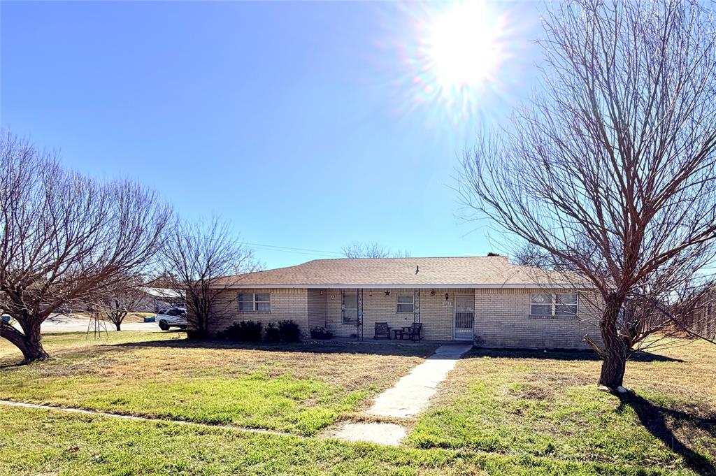 Spacious 3 bedroom 2 bath brick home located just one block from Goldthwaite High School. This well laid out home offers great potential for a buyer ready to make it their own. An additional room off the living area provides the perfect space for a home office playroom or hobby room. The primary bedroom features two closets and a large ensuite bath with dual vanities. The kitchen has a functional layout and is ready for updates including replacement of the cooktop and oven giving the next owner the opportunity to customize to their taste. Flooring is needed throughout allowing buyers to choose exactly what they want from the start.

Outside you will find a fenced backyard ideal for pets along with three separate storage areas for tools equipment or projects. The home also includes a large utility room with sink a spacious two car garage with remote entry and an additional two car carport for extra parking or covered storage. Solid brick construction generous space and an excellent location make this a great opportunity for someone looking for a comfortable home with room to add value.