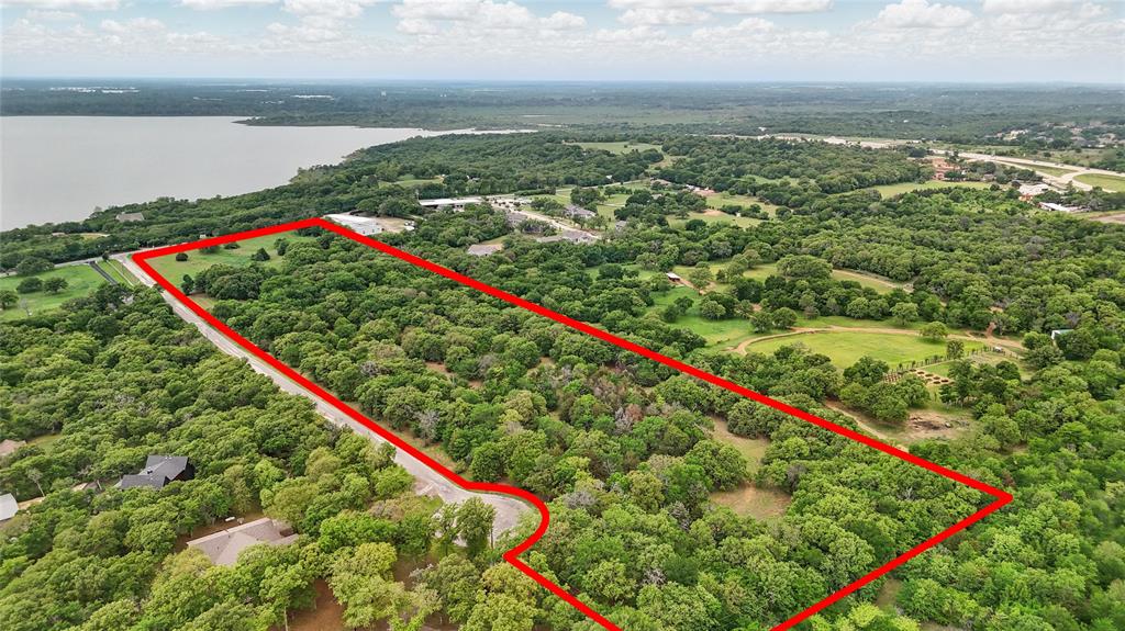 Privacy and natural beauty await on this almost 17 acre property, an ideal setting to create your own ranch estate. Among towering trees, a pond and meandering paths, this land is tucked away on a quiet cul-de-sac. Located approximately 1 mi south of Hwy 380 in Cross Roads, near the north side of Lake Lewisville this rare opportunity exists to enjoy the best of both worlds - peaceful country living with nearby attractions, activities, parks and lakes. Equine facilities as well as boating on Lake Lewisville are a short drive away. This property is conveniently located near the DFW metroplex. Road frontage on both Turner Road and Moseley Road provide excellent access options. Water and electricity are available, will require septic system. Bring your dreams and explore the many possibilities this property provides! Development opportunities also are possible with preliminary plans and studies available.
