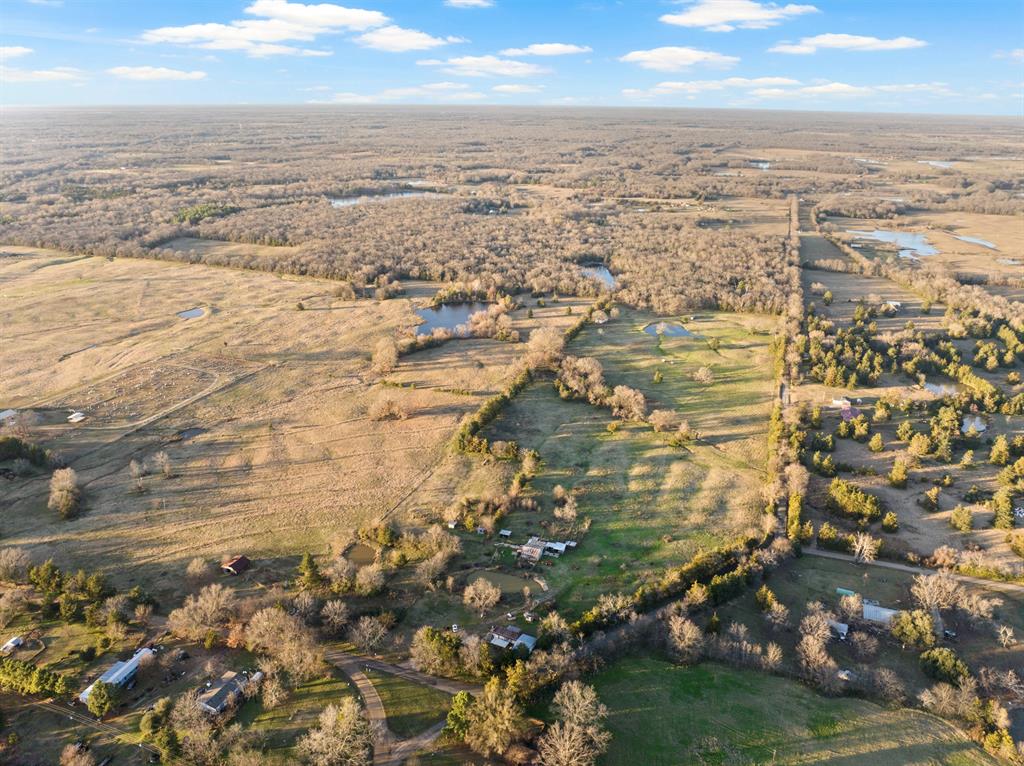 This sprawling property spans over 80 acres and features multiple picturesque ponds throughout. Adding to its appeal are four mobile homes that are currently situated on the land, offering a profitable investment opportunity for potential buyers.Whether you are a developer looking for your next project location, wanting to capitalize on rental income or create a serene retreat for yourself, this property presents endless possibilities. Don't miss the chance to own a piece of land with such versatile potential and natural beauty.