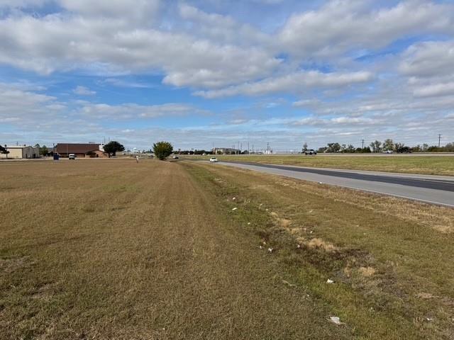 Prime commercial lot located in a highly visible, high-traffic area, directly accessible from the highway. This centrally located parcel offers tremendous potential for retail development, with excellent exposure to both local and passing traffic. The lot is fully cleared and ready for immediate construction, and essential utilities including water, sewer, and electricity are available. Perfect for businesses looking to capitalize on a thriving, well-traveled location.