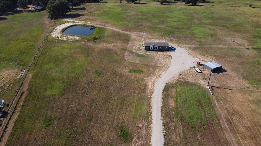 MOTIVATED SELLERS - BRING OFFERS!  The search is over! Here is your beautiful new home on 15 acres! This 2023 Oak Creek home with scenic views in Cumby TX offers a Tifton 44 hay meadow with Ag Exemption, stocked fishing pond with a 24x24 shop. Located in the very sought after Miller Grove ISD and situated off of a quiet county road. This farmhouse style home has an open concept split bedroom floor plan. Kitchen is fully equipped with a large island, farm sink, and plenty of cabinet and counter space as well as a full size dining area next to kitchen. Utility room is spacious with extra storage and a place for a freezer or another fridge. Primary bedroom has an en-suite bath with double vanity, oversized shower, and large walk-in closet. There is ample space on the land for livestock, a barn, boat, RV, ATV, garden or even an additional home. This would be a perfect place for your family. Come see it today!