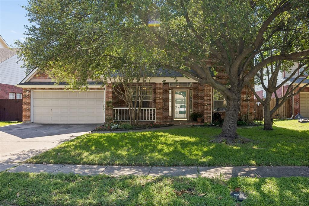 This charming two-story brick home sits behind mature trees and well-kept landscaping, giving it a welcoming presence from the moment you pull up. The main floor centers around a bright, open family room with an abundance of windows that keep things feeling airy and inviting. The large kitchen is open to the family room and features an island along with a sunny breakfast nook — a natural spot for morning coffee or casual meals. A separate dining room handles more formal occasions, and a dedicated home office gives you a quiet place to work. A generously sized utility room and a half bath round out the first floor nicely. The primary suite is where this home really shines. The bedroom is large and comfortable, and the fully updated ensuite bathroom is a genuine highlight — a walk-in shower, a garden tub, and a spacious walk-in closet make it feel like a space you'll look forward to retreating to at the end of the day. Upstairs, three additional bedrooms are served by two full bathrooms, and a bonus living area at the top of the stairs adds a flexible hangout space — great for a playroom, den, or second lounge. Out back, a large yard gives you plenty of room to enjoy the outdoors, and the two-car garage wraps things up. A solid, move-in ready home with a layout that just works and a primary bathroom that steals the show.