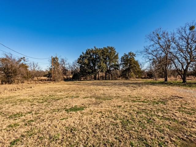Builders and investors, take note! Oversized double lot (Lots 88 & 89, approx. 0.35 acre) in the sought-after Canyon Creek lake community on Lake Granbury. With two platted lots combined, there's rare room here for a spec home or custom build in a neighborhood loaded with amenities — two pools, boat ramps, private beach, clubhouse, tennis, playgrounds, and lake access. Convenient to Granbury's historic square, shopping, and schools. Property is being sold for lot value only. Existing mobile home holds no value, is not insurable, and must be removed at buyer's expense. Bring your plans and build where people want to live!
