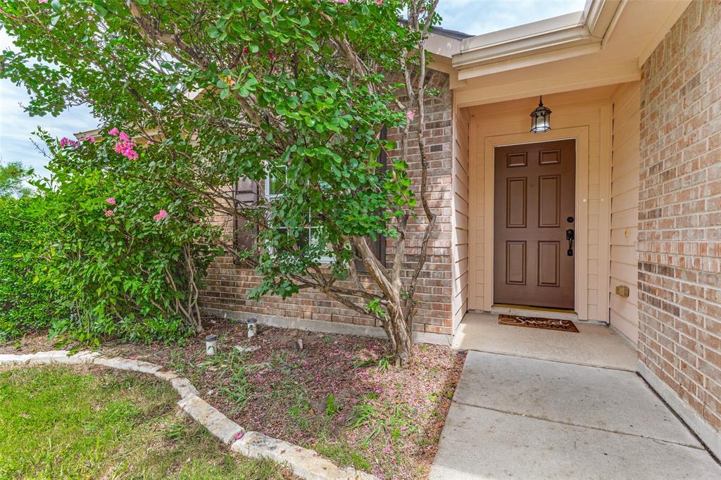 PREMIUM CORNER LOT, KELLER ISD From the moment you walk in this home, the seamless  flow of this one-story layout with open airy spaces is designed to bring people together. The spacious living area naturally draws everyone in with a gas fireplace as the focal point. Rich wood floors throughout, decorative statement lighting, eat in kitchen with SS appliances, granite countertops, window bench in the breakfast room makes this architectural feature unique. 4 bedrooms and 2 full baths has enough dedicated space for everything you need, with the primary bedroom is a spacious tranquil retreat with a walk in closet. The Villages of Woodland Springs is designed to feel like a resort, you can spend your summer afternoons cooling off in the community pool. Take a quiet evening stroll on the walking trails, step over to the community catch and release fishing ponds or the sports courts and amenity center are just minutes from your front door. 12301 Angel Food Lane offers a sense of belonging you'll feel the second you walk through the door.