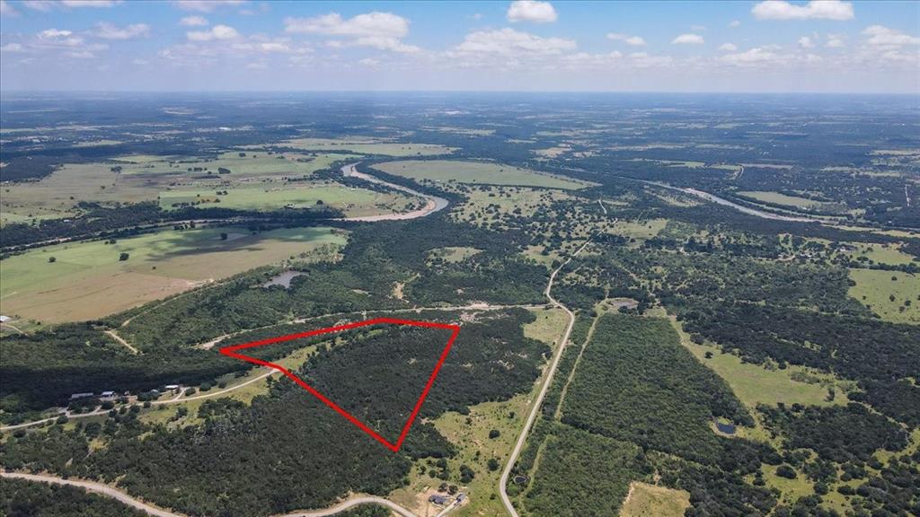 Experience breathtaking panoramic views from the highest point in the exclusive gated community of Brazos Mountain Ranch. This prime 21-acre parcel offers the perfect canvas for your custom cabin or barndominium, providing a serene hill country retreat just 45 minutes from the sparkling shores of Possum Kingdom Lake and minutes from the newly opened Palo Pinto County State Park — one of Texas's most anticipated outdoor destinations.
Residents enjoy premium community amenities including beautifully maintained paved roads, a secure gated entrance, and coveted private access to the scenic Brazos River — a rare and highly sought-after feature that sets this community apart.
Perhaps one of the most compelling aspects of this property is the extraordinary financial advantage it offers. Mandatory membership in the community's Grazing Association secures a valuable Agricultural Exemption, keeping annual property taxes on all 21 acres remarkably low. With a modest annual HOA fee of just $912 covering the maintenance of all common areas, roads, and gates, ownership here is as economical as it is exceptional.
Whether you're dreaming of a private weekend escape, a full-time residence, or a long-term land investment, this spectacular hilltop property delivers unmatched views, unbeatable value, and an unrivaled sense of peace. Opportunities like this are rare — schedule your private land tour today and come walk your future retreat!
