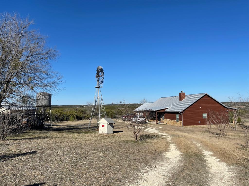 Looking for a peaceful place with a million-dollar view, then this may be just
the place for you. Rustic ranch home with beautiful trees and all on 24.95 corner
acres. Original homestead is still on the property and was lived in 9 years ago.
Needs some TLC to make it a variety of venues. Anything from guest house,
rental property or an Air B and B, since it is so close to Rough Creek Lodge.
3 bedrooms and 2 baths with a 3-car-attached garage. Great back and front
porches to enjoy the outdoors. Motivated seller with several incentives. Working
windmill to water your garden and trees. Come see us soon to find out about the
incentives.  This property is priced well below tax assesors value Make an appointment today!!!