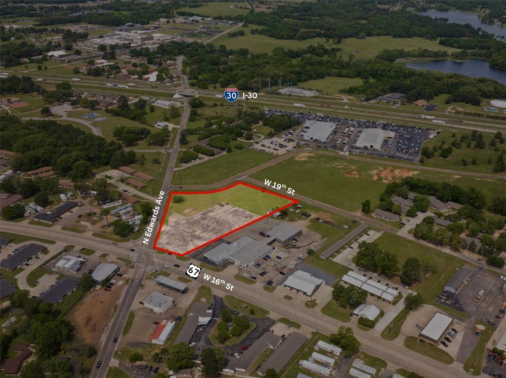 Prime 3.7 acre commercial lot featuring road frontage on three sides, offering excellent accessibility and visibility. Conveniently located near I-30 in a high-traffic area, this property is ideal for a variety of commercial uses. Owner is also open to long term lease opportunities.