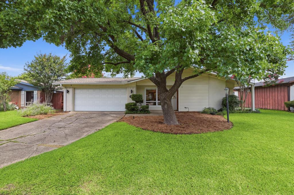 Discover this extensively renovated and energy-efficient mid-century modern home in Dallas. A stunning mahogany front door welcomes you into this truly turnkey residence, thoughtfully designed with both style and functionality in mind. Step inside to find a spacious open-concept floor plan enhanced by extensive LVP flooring and seamless sightlines throughout the main living, dining, and kitchen areas. The chef's kitchen is sure to impress with top-of-the-line Bosch stainless steel appliances, including a 5-burner gas range, professional vent hood, custom white oak cabinetry with soft-close drawers and pull-out organizational features, Quartz counter-tops, and an expansive 12 foot island that offers ample space for gathering. A built-in dry bar with beverage fridge leads into a versatile bonus room complete with a wet bar and direct access to the backyard, making it ideal for entertaining. The primary suite features two walk-in closets, including one outfitted with an Elfa closet system, along with a separate vanity area. Both bathrooms have been beautifully renovated with modern vanities, updated flooring, designer fixtures, and stylish tiled showers. Continue outdoors to a peaceful backyard retreat featuring an extended patio and plenty of grassy space for kids and pets to play. Adding to the home's exceptional appeal is an impressive suite of energy-saving features, including paid for 12.8 kW solar array with Tesla inverters, a Tesla Powerwall 2 battery backup system, and an EV charger in the garage. The current owners have enjoyed no electric bill thanks to the robust solar system, providing substantial long-term savings and enhanced energy independence. Combined with backup power capabilities and numerous updates to the home's major systems, this residence delivers the perfect blend of modern comfort, sustainability, convenience, and peace of mind. Ideally situated just minutes from major highways, including 635 and the Dallas North Tollway.