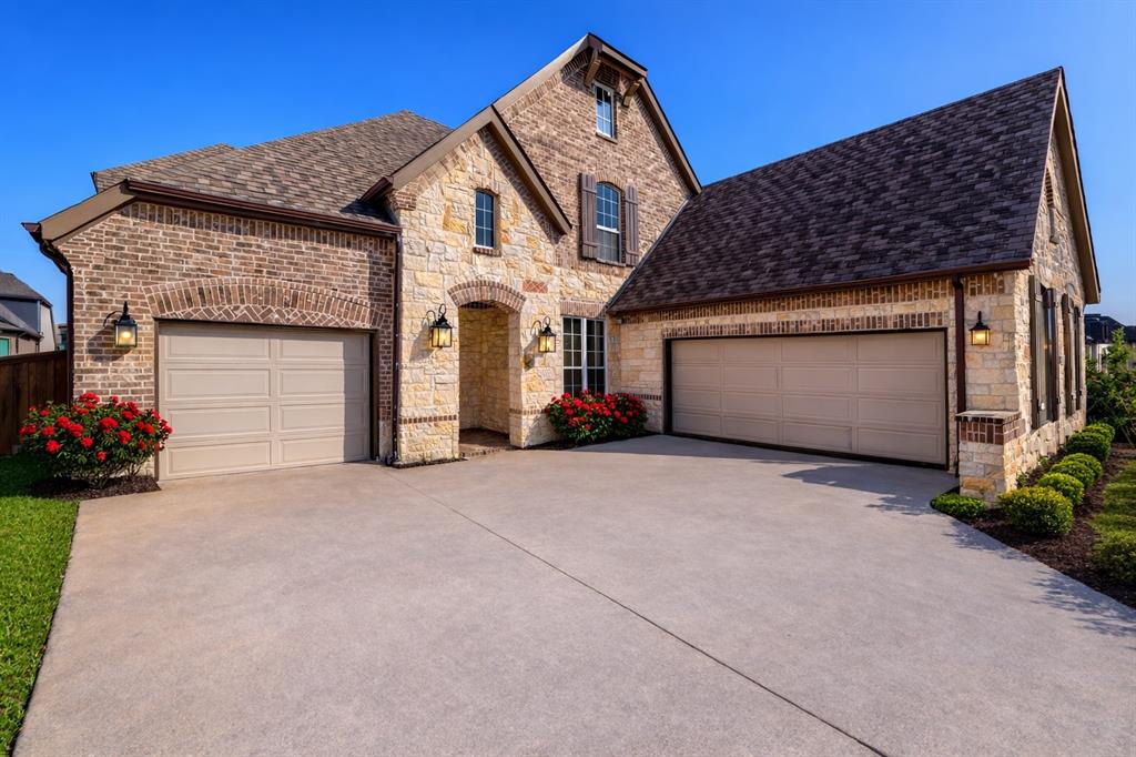 Cleverly appointed 5-bedroom, 5-bath, 3-car garage home of approximately 3,584 square feet in the desirable Parks at Legacy community in Prosper ISD. Remarkable for its walking proximity to K-12 schools, private rear courtyard, two first-floor en suite bedrooms, bonus cabinets, new upgraded carpet and padding, hardwood floors, and move-in-ready condition. The home opens into a light-flooded two-story foyer, with adjoining formal dining. Walk into the two-story living room with gas fireplace and tall windows. A chef’s kitchen features table and bar seating areas, quartz countertops, honed tile backsplash, stainless steel appliances, walk-in pantry, butler’s pantry, ceiling-height cabinetry, and expansive prep space. A luxurious first-floor primary suite with cathedral ceiling and spa-inspired bath has dual vanities, soaking tub, and large shower. A second downstairs bedroom has a shower bathroom for guests, in-laws, or home office. The professionally installed pre-wiring adds surround sound ready integration in the living room, patio, and primary bath. Upstairs, the theatre-ready media room adjoins a light-filled tray ceiling game room which overlooks the main living space. Each upstairs bedroom enjoys a connected bathroom, including a Jack-and-Jill arrangement with tub-shower and dual sinks. The uber-private backyard retreat’s custom paver patio is nestled in mature evergreen Eagleston holly trees for year-round natural beauty seen inside and out. The extended covered patio is finished with fans, lights, speakers, and a cedar privacy wall. A rare three-car garage configuration (dual bay and separate single-bay), with insulated doors and newly installed epoxy floors, gives outstanding storage and versatility. Residents enjoy two community pools, splash pad, stocked pond, playground, covered pavilions with grills and gas fireplace, and scenic walking trails. Quick access to Dallas North Tollway, and ideally located near PGA Frisco and Universal Kids Resort.