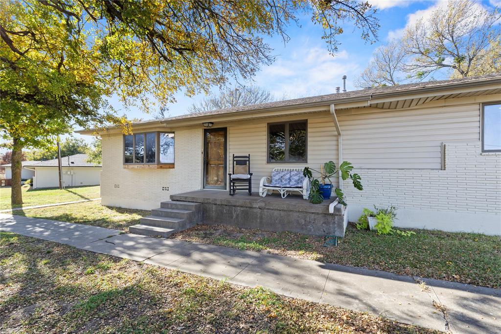 Welcome home to this beautifully remodeled property situated on 1 acre OUTSIDE city limits. Step inside and enjoy fresh interior paint, charming accent walls, and thoughtful updates that make the home feel warm and inviting. The large kitchen offers plenty of counter space and cabinetry, creating an ideal setup for cooking, gathering, and everyday living. The main living room features a striking floor-to-ceiling stone fireplace, while a second living area provides extra room to relax or entertain. A spacious bonus room adds even more versatility—perfect for a family room, office, additional bedroom, or potential second primary suite. The flat 1-acre lot is dotted with mature trees and includes storage sheds, a cozy backyard gazebo, and well and septic already in place. Located on North Main Street, this property offers a rare opportunity with an additional 1-acre lot next door also available for purchase. Whether you need extra space, want to expand, or envision a future live-work setup, this location provides wonderful possibilities. A home you truly need to see in person to appreciate.For a video and instant info, TXT RODEO5 to 88000.