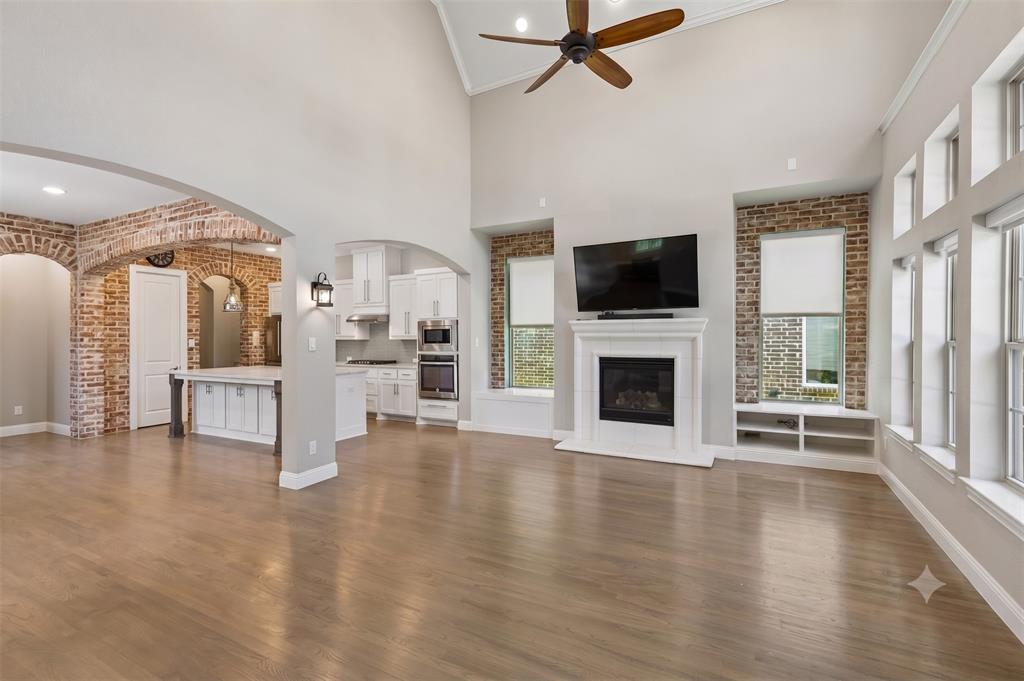 This beautifully updated Craig Ranch home is sure to impress from the moment you arrive. The spacious primary suite is conveniently located on the first floor and features a fully remodeled bathroom, custom closet build-out, and additional storage for maximum functionality. Fresh interior paint upstairs gives the home a bright, move-in-ready feel. The chef-inspired kitchen offers a massive island, abundant cabinetry, and a refrigerator that conveys with the property. Thoughtful custom touches continue throughout the home, including a built-out office workspace with desk and cabinetry, living room built-ins, plantation shutters and shades throughout, and a convenient mudroom located just off the laundry room. Step outside to your own private retreat. The side yard showcases mature trees, a pergola, trellis, retaining wall, and a relaxing hot tub that conveys with the home. A custom concrete patio extends the usable outdoor space, while a stepping-stone pathway provides easy access to the side gate. Additional highlights include an epoxy-coated garage floor and extra storage cabinets in the garage. Ideally located near Lifetime Fitness and just minutes from TPC Craig Ranch Golf Course, shopping, dining, and entertainment, this home offers the perfect combination of comfort, convenience, and style.