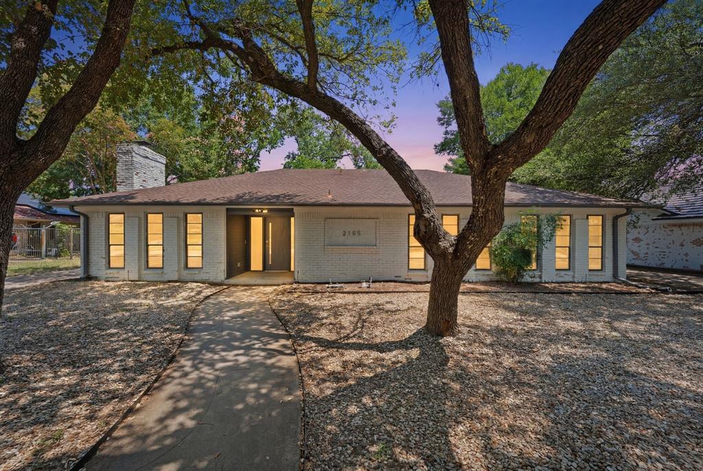 Tucked away on a quiet, tree-lined street, this spacious contemporary home combines modern design, flexible living spaces, and an exceptional Arlington location. Step inside to discover an open-concept layout where the living and dining areas serve as the heart of the home, creating a warm and inviting space for gathering, entertaining, and everyday living. Anchoring the design is a beautifully integrated kitchen that keeps the chef connected to the conversation while offering the perfect blend of functionality and style. Together, these spaces create an ideal setting for hosting family and friends or simply enjoying a quiet evening at home. A flexible bonus room provides endless possibilities, whether you envision a home office, media room, fitness studio, playroom, or additional living area. The thoughtfully converted garage further expands the home's versatility, offering valuable additional living space to accommodate your evolving needs. The private primary suite offers a peaceful retreat, thoughtfully positioned for privacy, comfort and relaxation. Three generously sized secondary bedrooms provide abundant space to accommodate a variety of lifestyles. Whether used for family, guests, a dedicated workspace, creative pursuits, or multigenerational living, these rooms offer the flexibility today's buyers desire while allowing the home to adapt seamlessly as life changes over time. Outside, the gated driveway provides ample parking and includes both 30-amp and 50-amp hookups, making it ideal for RV or boat owners. Just minutes from Arlington's Entertainment District, AT&T Stadium, Globe Life Field, parks, restaurants, shopping, and entertainment, you'll enjoy easy access to some of the area's top attractions. For outdoor entertainment, Randol Mill Park is less than a quarter mile away and features walking trails, a playground, splash pad, and picnic areas. A rare opportunity to own a home in a prime location at an exceptional value.