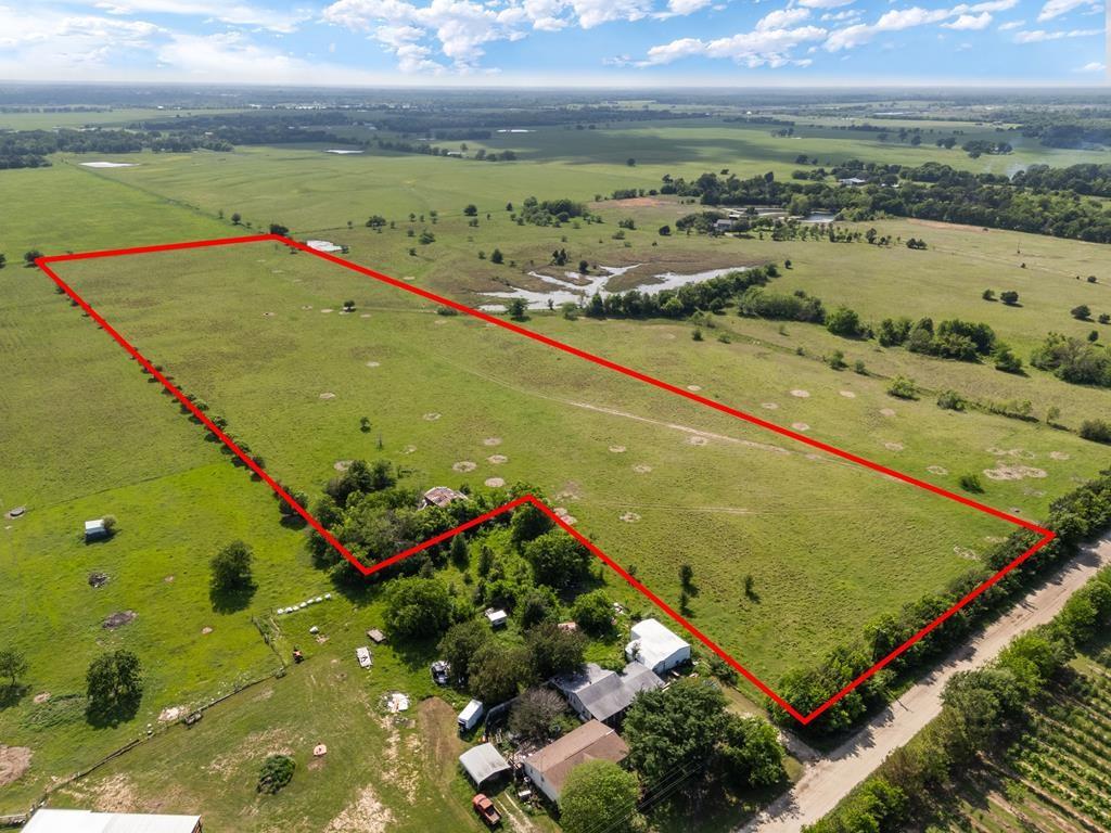 This 22.45-acre property offers an exceptional opportunity for those seeking expansive land in the highly desirable Van Zandt County. Located in Wills Point, TX, it is conveniently situated just an hour from the Dallas Metroplex, with easy access to Highway 80, ensuring seamless connectivity to major cities. The land features a prime location adorned with beautiful trees and currently benefits from an agricultural exemption for cattle and hay use. There is an old barn on the property that could be rebuilt or torn down. (no value given) Surrounded by attractive ranches and large homes, the property’s appeal is further enhanced by its great location and road frontage. While a septic system will need to be installed, both water and electricity are readily available at the road. With extensive road frontage, the property provides ample space to construct your dream home or barndominium. Its prime location ensures easy access to nearby amenities and is just minutes from Canton and the renowned First Monday Trade Days. Being part of the award-winning Wills Point ISD further enhances the property's value, making it an ideal choice for discerning buyers.