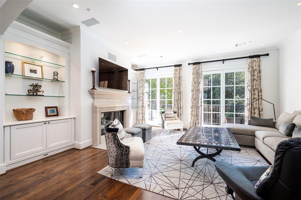 Luxury meets lifestyle in this gated Cascada at Turtle Creek residence, where three-story elevator living pairs effortlessly with direct access to the Katy Trail. European-inspired architecture, iron balconies, and a private motor court create a distinguished arrival, while an elevator provides seamless access to all levels. Light-filled interiors feature soaring ceilings, rich hardwood floors, gracious entertaining spaces, and a chef’s kitchen with marble countertops, professional-grade appliances, and generous island seating. A beautiful home office or library offers a refined and private work retreat. All three bedrooms include en suite baths, highlighted by a serene primary suite with spa-like marble bath and expansive custom closet. A private courtyard with stone terrace and built-in grill opens directly to the Katy Trail, blending lock-and-leave luxury with one of Dallas’ most sought-after lifestyles.