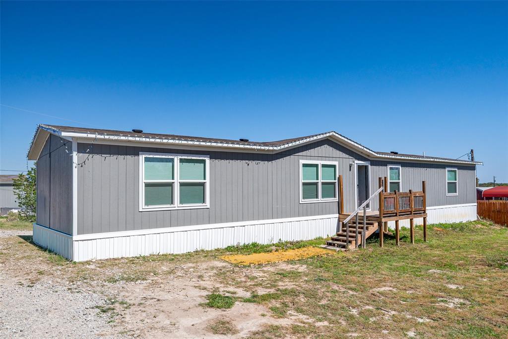 ** Do not sleep on this opportunity! **  Whether you are looking to purchase your first home, need more space for the family, or looking for investment property, this house can be what you need it to be.  With over 2,000 square feet, this double-wide manufactured home was installed in 2023 and sits on two lots in the Oak Hills subdivision.  Walking in the front door, guests are greeted with an open floor plan with distinctive living room, kitchen and a flex space that can be used a dining room, office space, or whatever the family needs.  Home features 4 bedrooms with 2 full bathrooms.  Primary bedroom is on one side the home with a built in desk and large bathroom with walk in closet.  Other 3 bedrooms are on the opposite side of the home with two of the rooms featuring walk in closets.  Guest bathroom has built in linen shelving.  Kitchen features a large island that sits 2 barstools and has incredible storage space.  Utility room is located off the kitchen with door to the backyard.  Natural light fills the home.  Lots have been cleaned off for easy maintenace.  Home can be financed FHA or VA.  This is a one-owner home looking for its next family...come see what it can offer you!