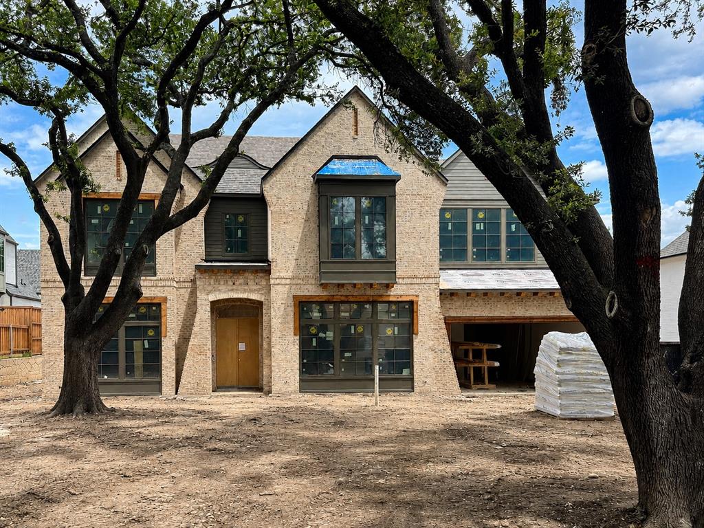 New construction in one of Lakewood’s most coveted neighborhoods, this stunning custom home by Fairmont Homes exemplifies refined transitional design. Nestled on a quiet, tree-lined cul-de-sac, the residence showcases exceptional craftsmanship, thoughtfully curated finishes, and premier amenities—offering an elevated lifestyle just steps from the shores of White Rock Lake. The thoughtfully designed floor plan features 6 bedrooms, 6.1 baths, a 3-car garage, and a backyard retreat with pool. Downstairs, the impressive primary suite offers a coffee bar, spacious closet, and en-suite laundry. Guests will also enjoy a private downstairs suite with backyard access and serene views. The family room, anchored by a striking center fireplace, opens to expansive sliding doors that seamlessly connect to the outdoor loggia, while the formal lounge, complete with a wet bar, is perfect for more intimate gatherings. The chef’s kitchen is a showstopper, featuring a secondary working pantry and seamless flow to the formal dining area and a gorgeous breakfast nook with floor-to-ceiling windows and banquette seating. Upstairs, four secondary bedrooms each include en-suite baths and walk-in closets, alongside a spacious game room, a second laundry, and a dedicated office offering a quiet space to work or reflect. The incredible backyard retreat features private treetop views from the loggia, an outdoor kitchen, sparkling pool and spa, and a large turf yard—perfect for entertaining or relaxing. The rare 3-car garage includes a double-depth tandem bay, providing ample space for vehicles, strollers, and bikes. A truly special location, ideal for families and outdoor enthusiasts alike, offering peaceful streets, neighborhood gatherings, and unmatched access to White Rock Lake, the SoPac Trail, and a 2.5-acre park seamlessly connected to the community.