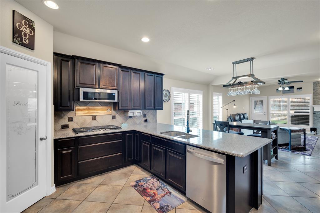 Welcome home to modern convenience and effortless living.
This stunning 3-bedroom, 2-bath ranch-style home, built in 2015, offers a versatile layout designed to complement every lifestyle. The open floor plan fills each main living area with abundant natural light, while plantation shutters provide the perfect balance of brightness and privacy.
Need a dedicated workspace? A tucked-away front office delivers the quiet and seclusion ideal for remote work or a personal library. Looking for more room to play? An expansive bonus space stands ready for a home theater, pool table, or the ultimate hobby room.
At the end of the day, retreat to a spacious primary suite featuring a spa-inspired ensuite with his-and-her sinks, a rain shower head, and double additional shower heads for a truly luxurious experience. Walk-in closets in every bedroom ensure storage is never a concern.
Step outside and elevate your entertaining game with a fully equipped outdoor gas kitchen — perfect for dining under the stars. Mature landscaping wraps the backyard in natural privacy, creating a peaceful escape that feels miles from the city. A 2-car garage with built-in cabinetry rounds out the home with generous vehicle and storage space.
Community amenities include a pool, parks, a community garden, and a boat dock — everything you need just steps away.
? Brand new Class 4 impact-rated roof just installed.
Schedule your private showing today — this one won't last!