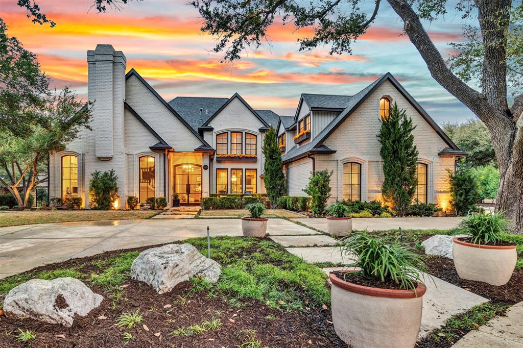 $800K in total renovations! Discover luxury living in this custom home nestled in a cul-de-sac in the prestigious Willow Bend Lakes! Experience the elegance of a meticulously re-imagined open floor plan, radiating a subtle contemporary charm with designer finishes throughout and custom windows and steel doors. Step into a grand foyer, bordered by a formal dining room with a mirrored ceiling and an expansive living room featuring a stone fireplace and French doors leading to a versatile home office or bedroom, complete with built-in cabinets and desk. Any chef will be enchanted by the gourmet kitchen, boasting a professional Wolf gas range with double ovens and pot-filler, a Sub-Zero refrigerator, a built-in coffee station, a farm sink, and ample cabinetry. This culinary haven overlooks a family room with a wet bar and gas fireplace framed by large windows. The quaint breakfast room has a built-in cabinet, and the back of the house has a second guest bedroom downstairs with ensuite bath. A staircase in the spacious utility room leads to a separate game room with a wet bar, fridge, and full bath. The downstairs secluded primary suite features a garden tub, a triple-sized shower with dual showerheads, and a custom walk-in closet. A stunning staircase in the foyer leads to a media room and two additional bedrooms, each uniquely designed with features like vaulted ceilings, custom closets and ensuite baths. The expansive backyard unfolds into an oasis you'll never want to leave! A covered outdoor living area complete with ceiling fans and built-in heaters ensures year-round enjoyment. An outdoor kitchen with a built-in grill, cooler and a custom counter height table is perfect for any gathering. The sparkling pool and spa promise endless delight for friends and family, while a gas fire pit and large grassy area offers limitless possibilities.