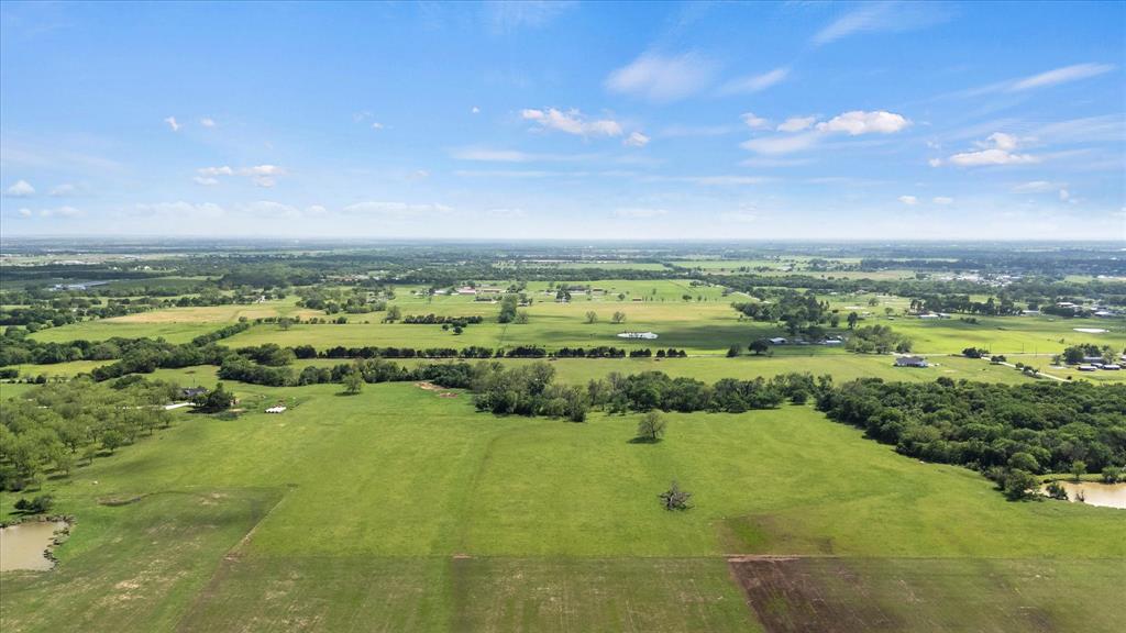 Endless Possibilities in the Heart of Pilot Point. Located in the highly sought-after community of Pilot Point, Texas, this remarkable 89+ acre property offers a rare opportunity to own a beautiful piece of the countryside with all the potential your heart desires. Whether you're dreaming of building a custom estate, raising livestock, or exploring development opportunities, this wide-open land delivers.
An old farmhouse sits on the property, adding a touch of rustic charm and character, but the real draw is the canvas awaiting your dream home. With ample space for cattle, horses, or your entire barnyard crew, this land is well-suited for agricultural use or simply enjoying the quiet beauty of open skies and rolling pastures.
Just minutes from the quaint and welcoming town of Pilot Point, you’ll enjoy a peaceful rural lifestyle with convenient access to city amenities. Don’t miss this chance to secure a piece of Texas land with endless potential — ideal for homesteading, ranching, or future development. Parcel ID 43377 offers 77.750 acres, while approximately 12 acres will be surveyed out of Parcel ID 43296 for an approximate total land of 89 acres. New survey will be required by buyer. Buyer to verify all measurements and taxes.