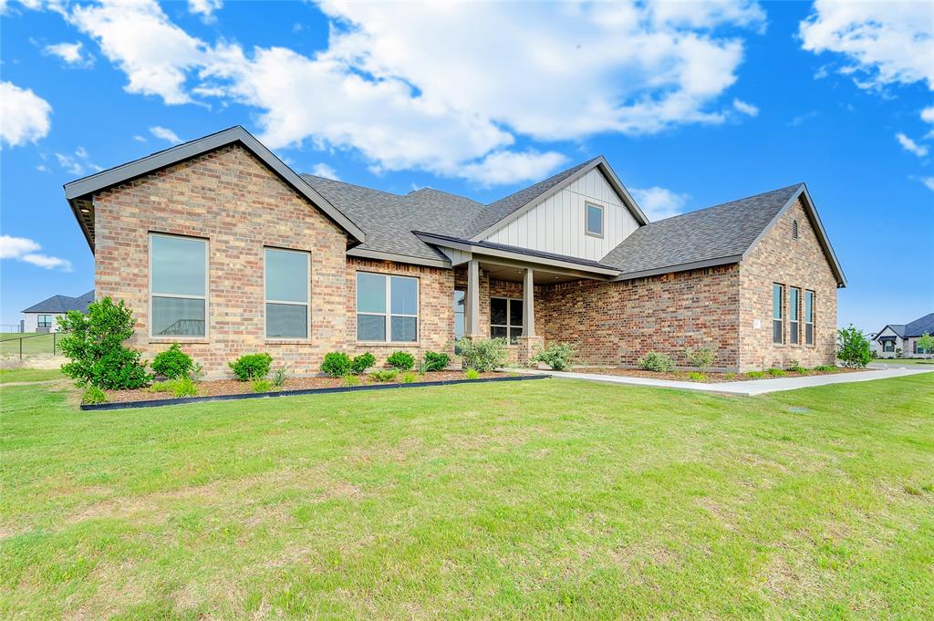 Experience the perfect blend of modern design and everyday functionality in this brand-new home by Silver Leaf Homes, a builder with over 30 years of experience. Located in Calhoun Acres, enjoy NO HOA and NO CITY TAXES—a rare find just outside the city with easy access to Fort Worth.
This spacious 5 bedroom, 3.5 bathroom home with 2,809 sq ft sits on a desirable corner lot and is filled with features today’s buyers are looking for—open concept living, natural light, high ceilings, and custom finishes throughout. The living room showcases a stunning floor-to-ceiling stone fireplace, exposed wood beam, and soaring ceilings, creating a warm yet elevated feel.
The chef’s kitchen is designed for both entertaining and daily life with white cabinetry, a large charcoal island, ample counter space, and abundant storage. A built-in desk area offers the perfect work-from-home or homework station.
The private primary suite on the main floor offers convenience and comfort, featuring a direct connection from the primary closet to the laundry room—a highly sought-after layout feature. Additional highlights include an oversized 3-car garage, mud bench, and functional storage throughout.
Upstairs, a versatile bonus room with full bath provides endless possibilities—ideal for a game room, guest suite, or multi-generational living.
Buyer Incentive: $10,000 towards closing costs or interest rate buy-down—potentially lowering your rate by up to 1%! Preferred Lender credit of $2,700 Towards closing cost.
Located directly across from the elementary school and just a short drive to Fort Worth, this home offers the space, flexibility, and location buyers are searching for.