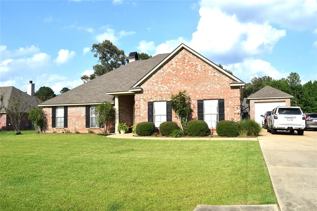 This beautiful home with 4 bedrooms and 2.5 Baths is nestled on a quiet culdesac in a highly sought after Corner Stone  gated community.It is zoned for Haughton Elementary Lil'Bucs,Haughton Middle School, and Haughton High School Buccaneers.From the mintue you step in you will enjoy the open-concept with wood burning F.P.,tall ceilings with lots of crown molding,with porcaline slate looking flooring in entry,den,kitchen and breakfast area.Nice kitchen w granite,S.S. appliances,walk in pantry,and convient breakfast area family meals .The remote primary B.R. has lots of crown molding,tray ceiling that features an exterior ensuite bathroom with a jetted tub,separte shower and his & her closets.There is a convenient half bath for guest.The additional 3 bedrooms and full bath are on the opposite side of the home.The garage has some built in cabinets and double garage door with remotes.The backyard has a wood privacy fence with lush grass,covered patio and pergola,and nice storage building.There is a 15x 30 ft. shop on slab with brick front and hardy board siding.It is finished with cedar siding and built in cabinets.It will hold a 20 ft. boat or 21 or 22 with swing away tung.Roof 2024,water heater 2017,Lot 95x140 Please call today for an appointment to see this ready to move in home!