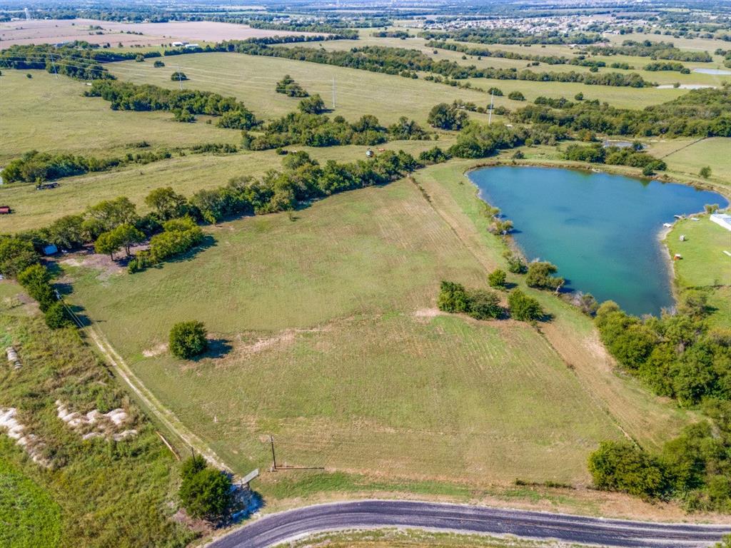 This 6 Acre tract in Nevada, Texas is the perfect canvas for your dream home or mobile home.  The property is fully fenced with barbed wire and features a prepared pad site, ready for construction.  Enjoy scenic views overlooking 3.5 Acres of a neighboring lake, offering a peaceful setting with plenty of space to spread out.
Conveniently located within half a mile of the Community ISD schools and with easy access to nearby larger towns, this property combines rural tranquility with everyday convenience. Whether you're looking to build now or invest in the future, this land offers a rare opportunity in a growing area.
